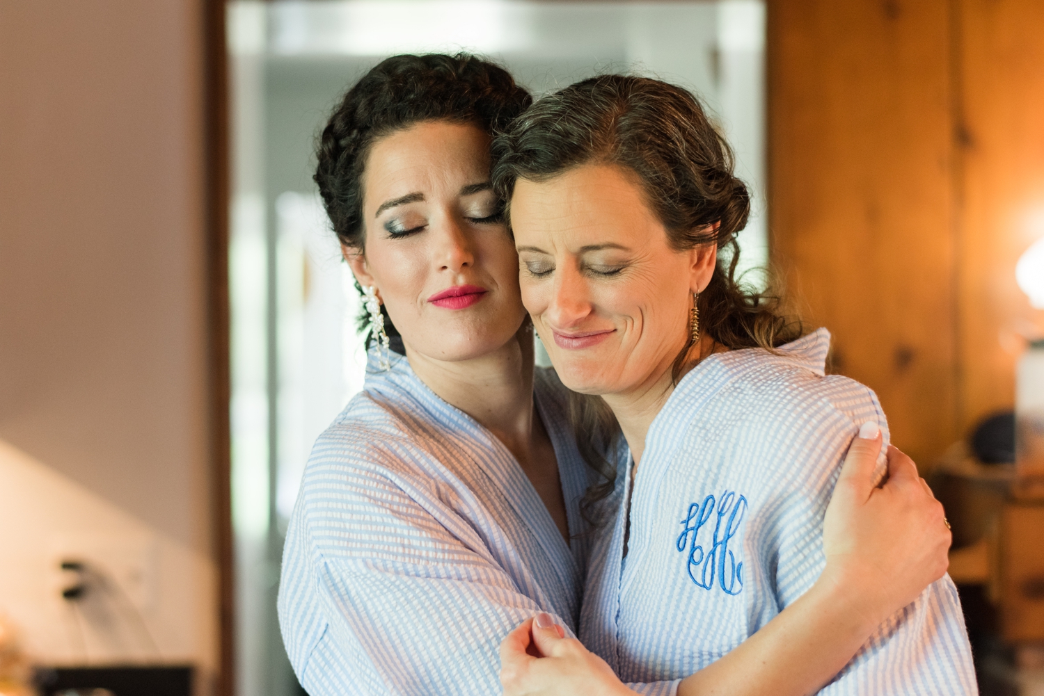 bride hugs bridesmaid