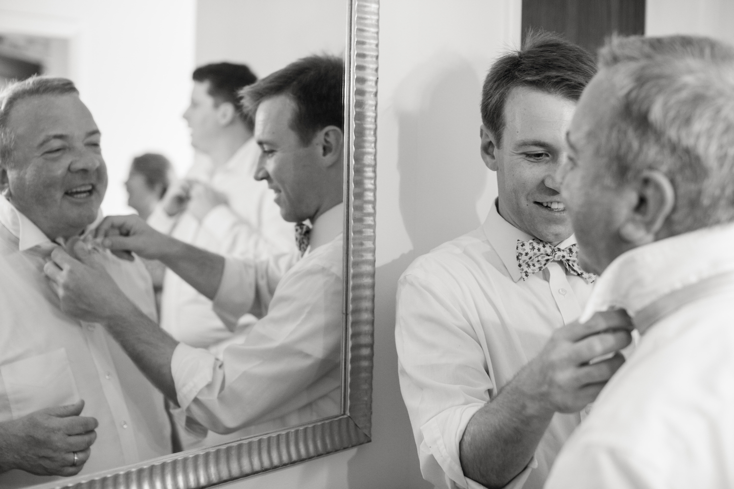 groom helps father with his bowtie