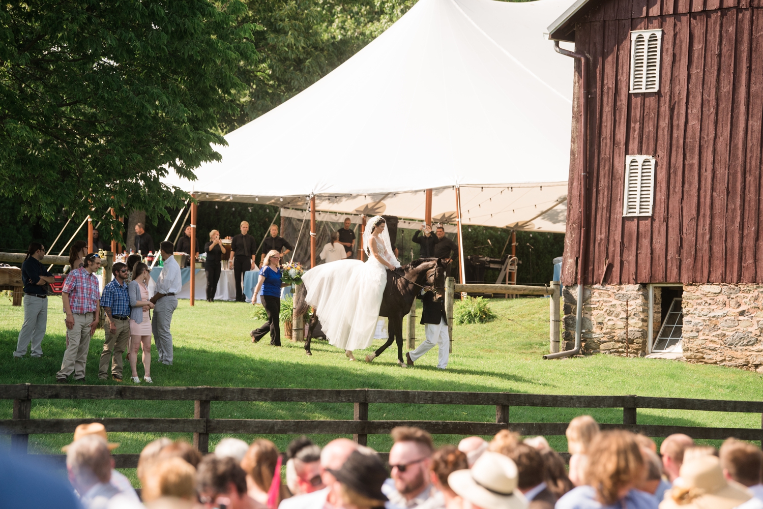 bride arrives to ceremony on horseback