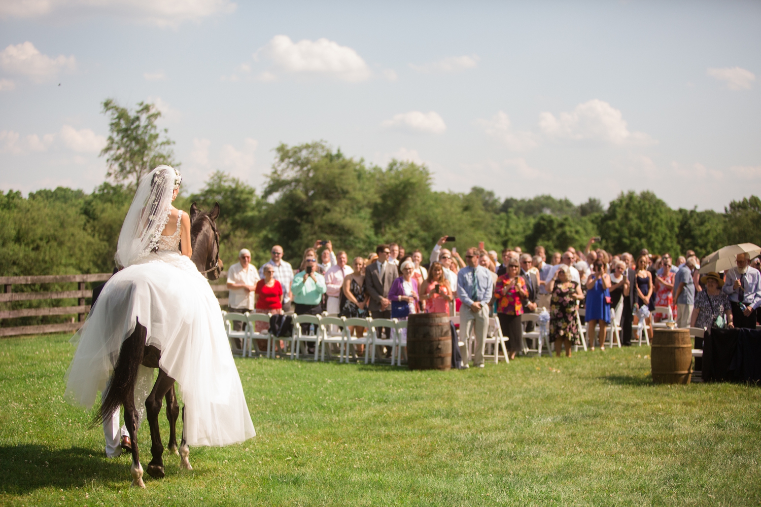 bride arrives to ceremony on horseback