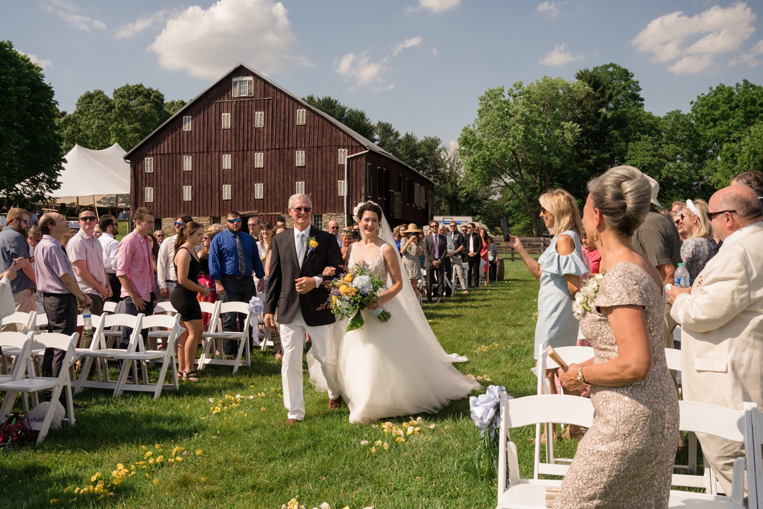 bride and her father walk down the aisle