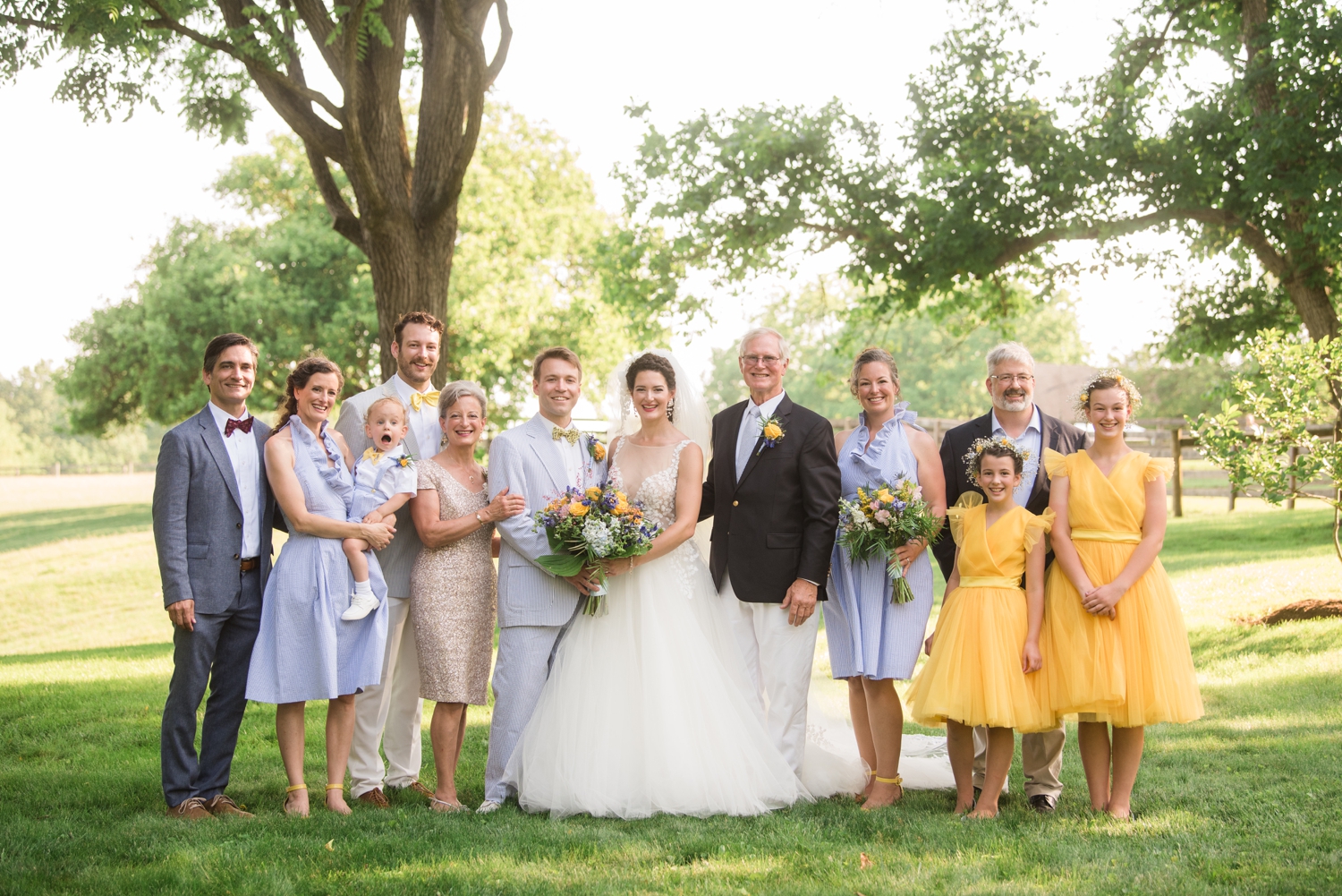 bride and groom with family