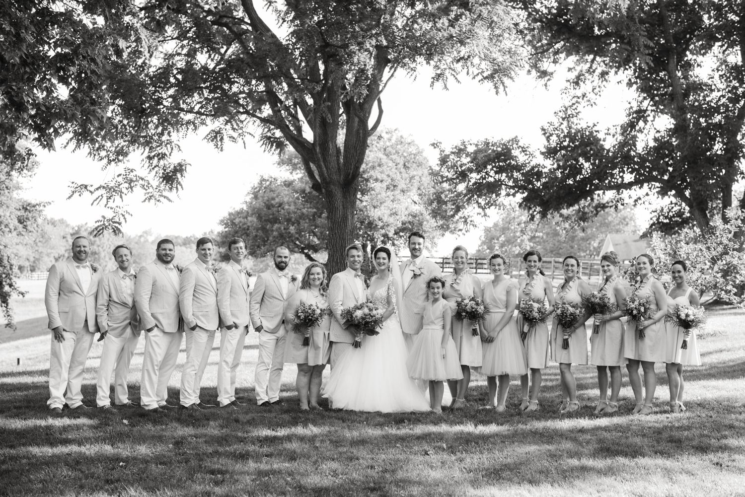 bridal party celebrates the newly weds