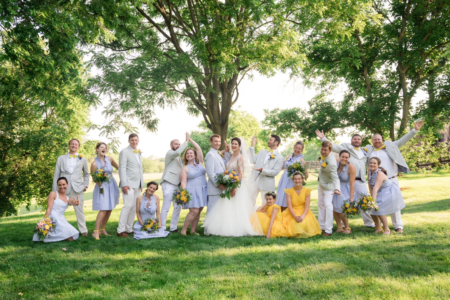 bridal party celebrates the newly weds