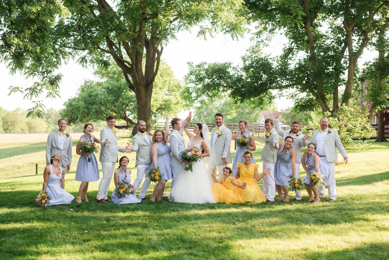 bridal party celebrates the newly weds