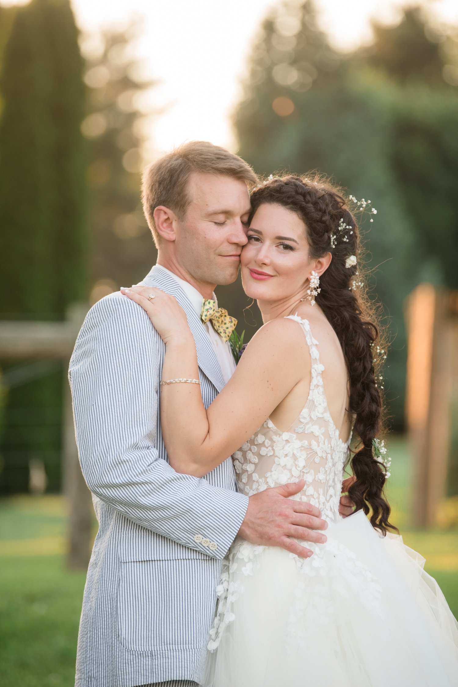 groom nuzzles his bride