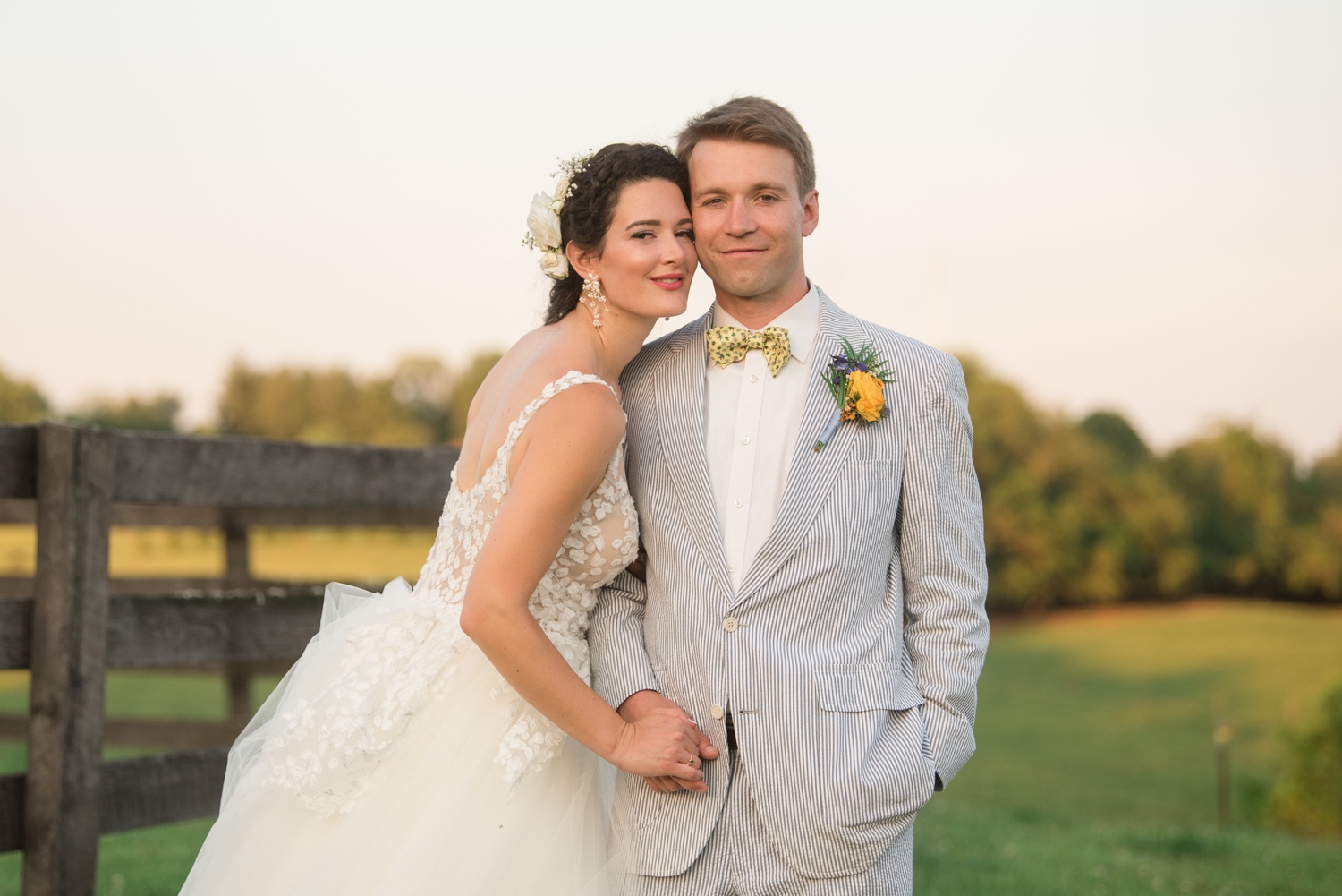 bride and groom love on each other