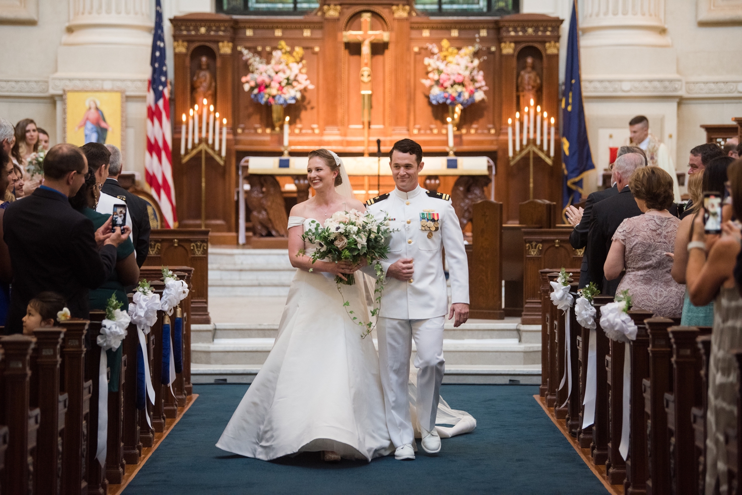 Bride and groom walking down the aisle.