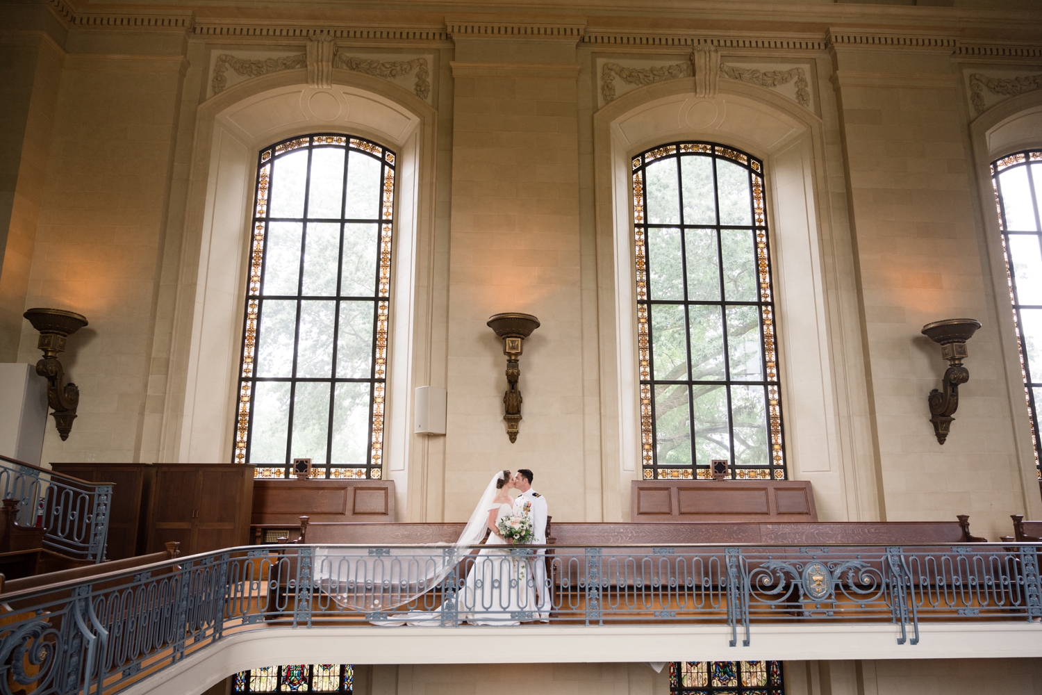 Bride and groom have a private moment on the choir balcony