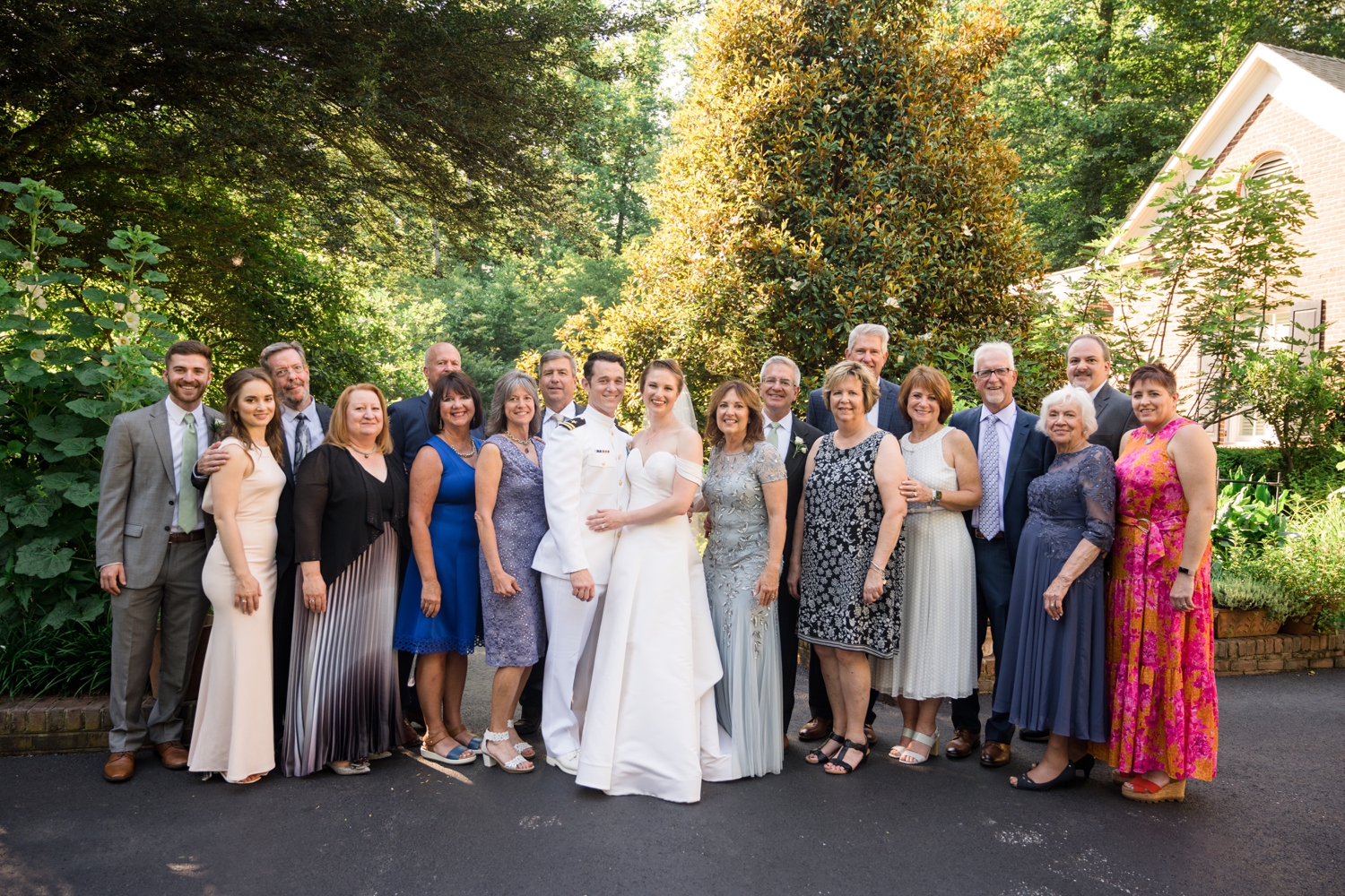 bride and groom pose for family formals