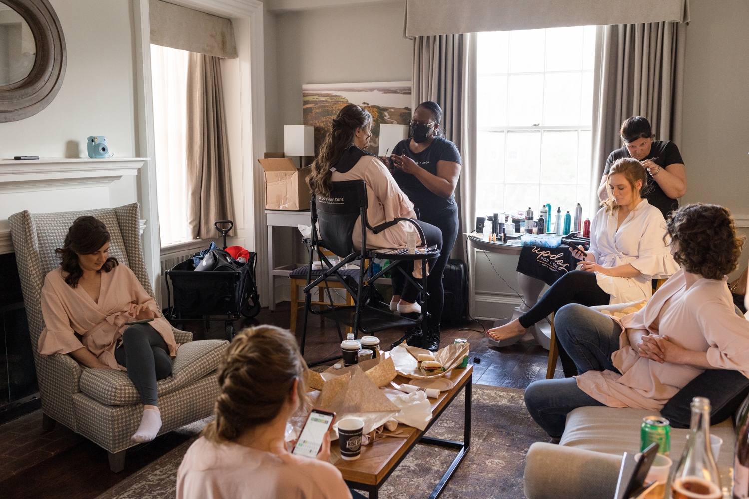 bridal party gets hair and makeup done in hotel