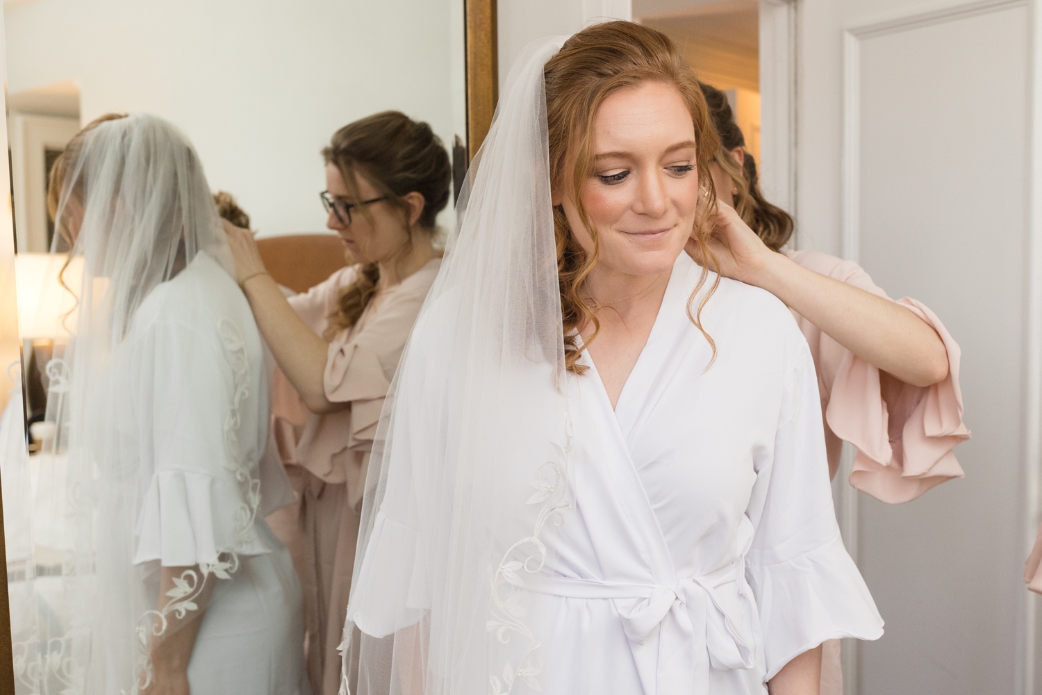 bride gets her jewelry on