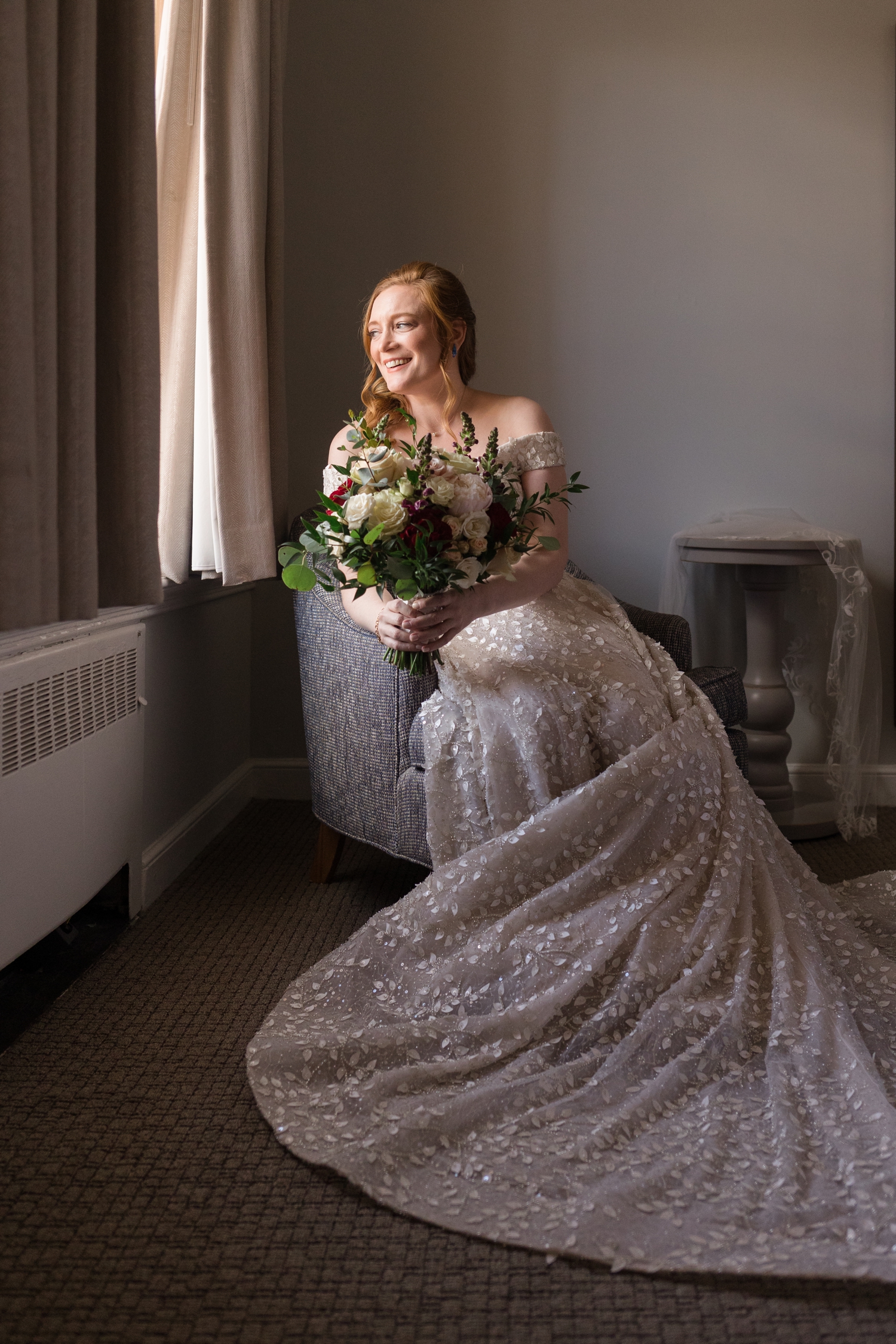 bride poses with her flowers