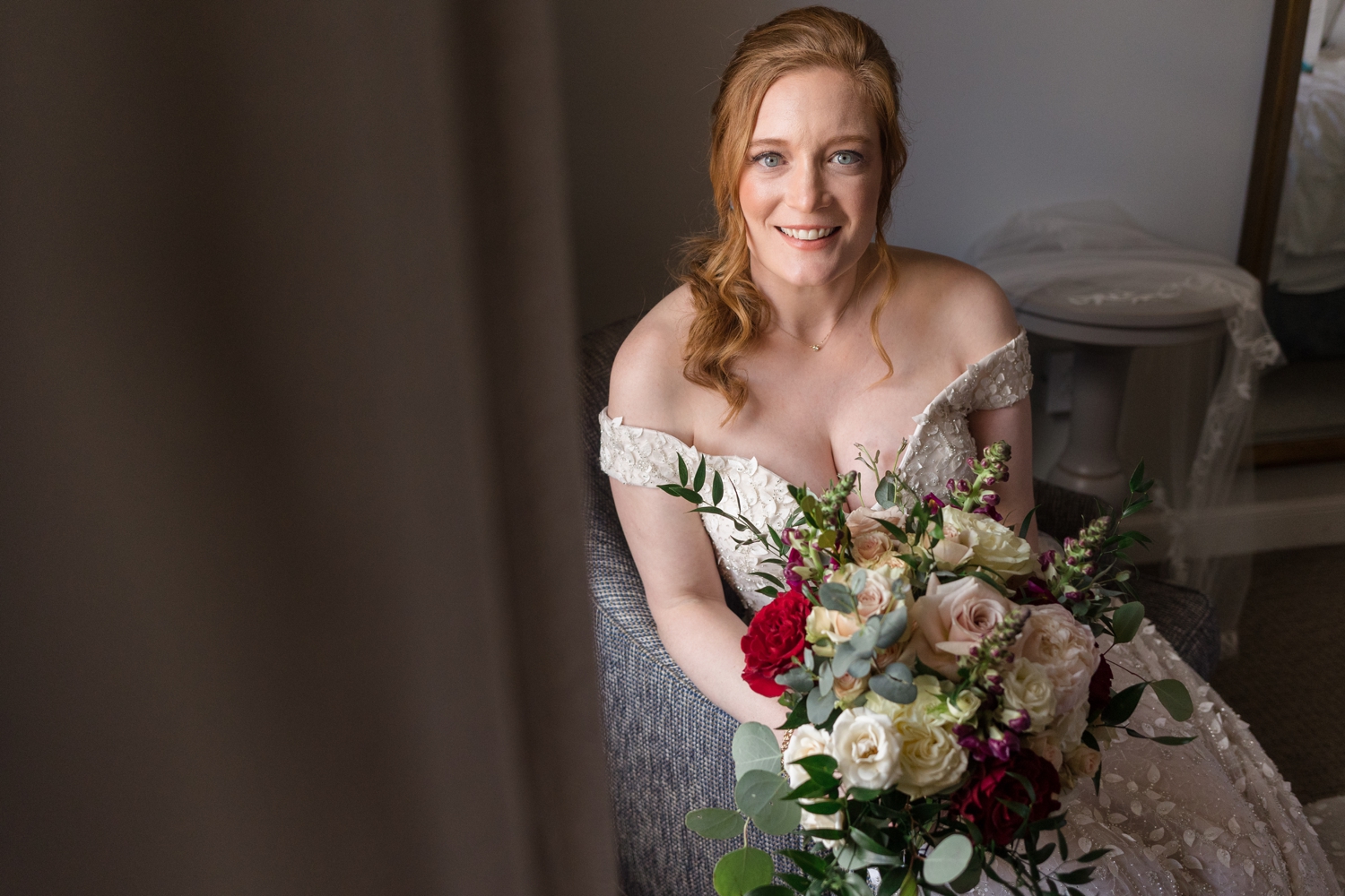 bride poses with flowers