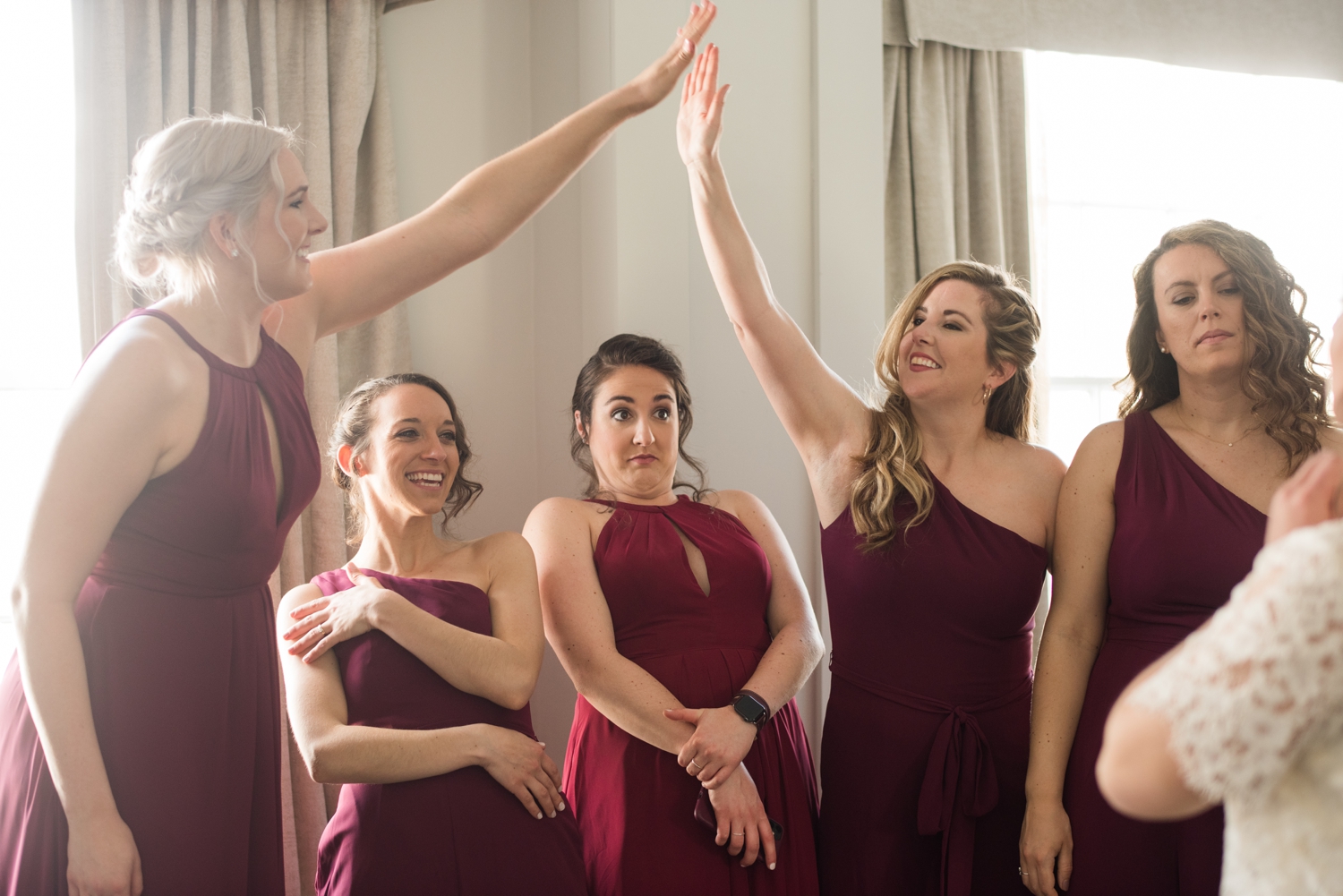 bridal party high-fives