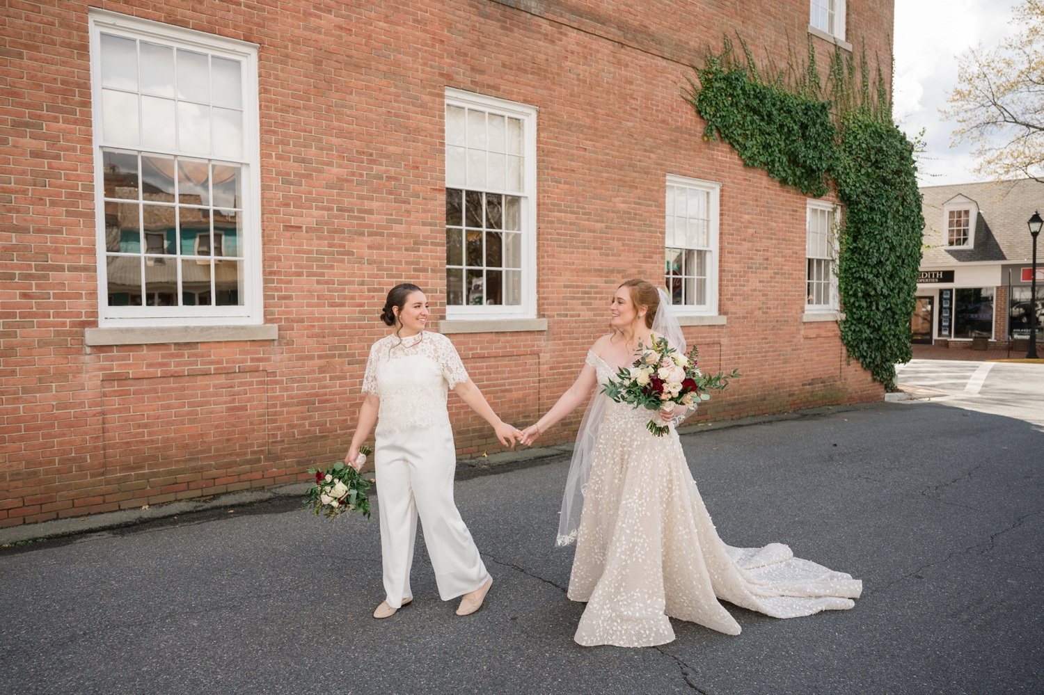 brides walk hand in hand 