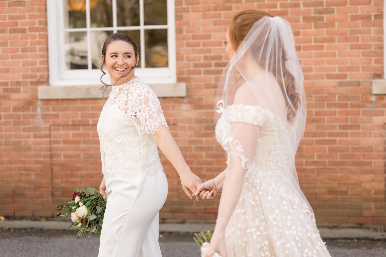 bride looks happily at her partner