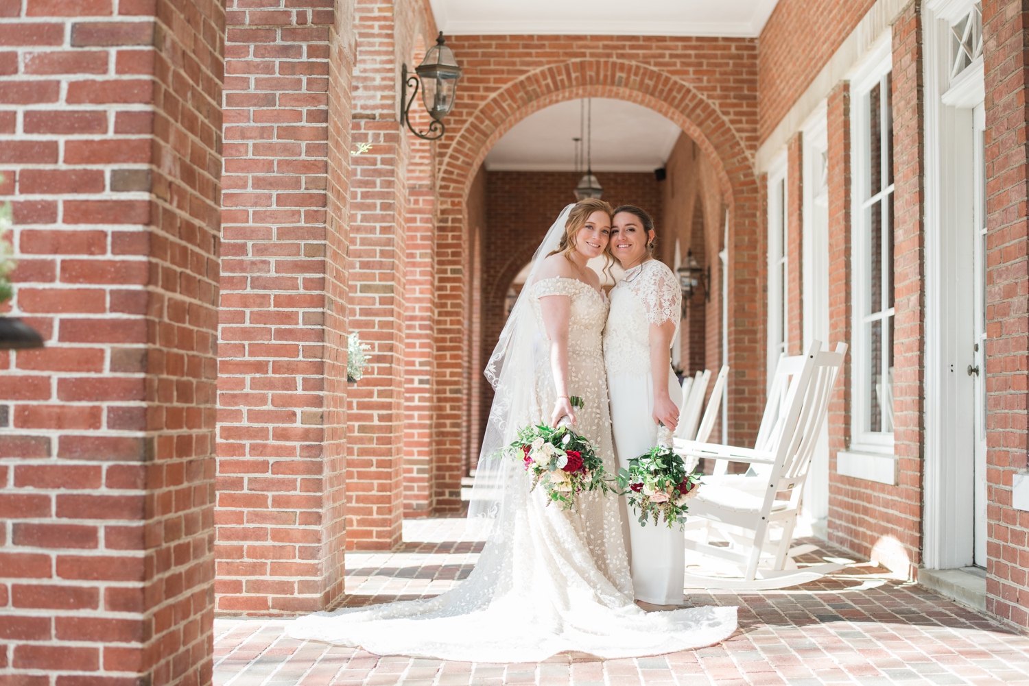 brides pose cheek to cheek at the Tidewater Inn