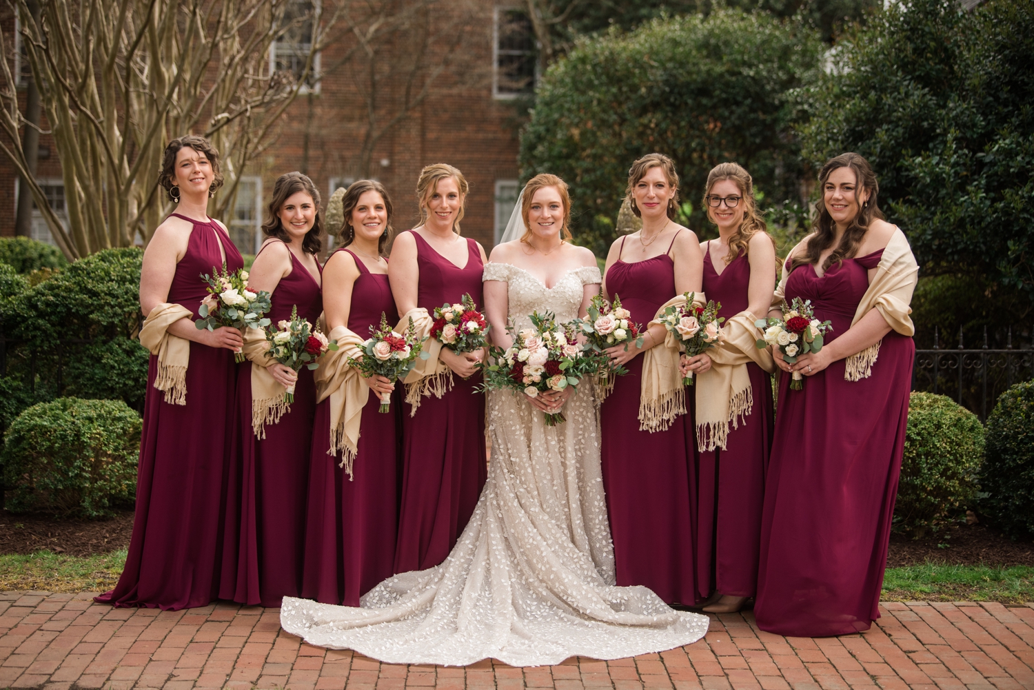 bride poses with bridesmaids