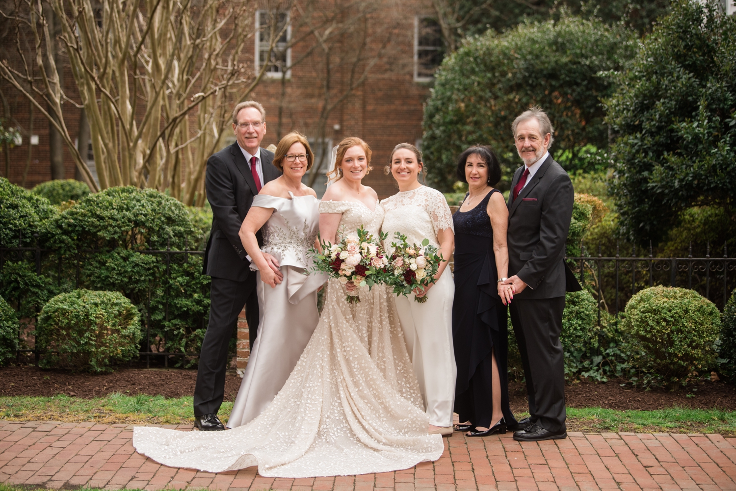 brides pose with parents