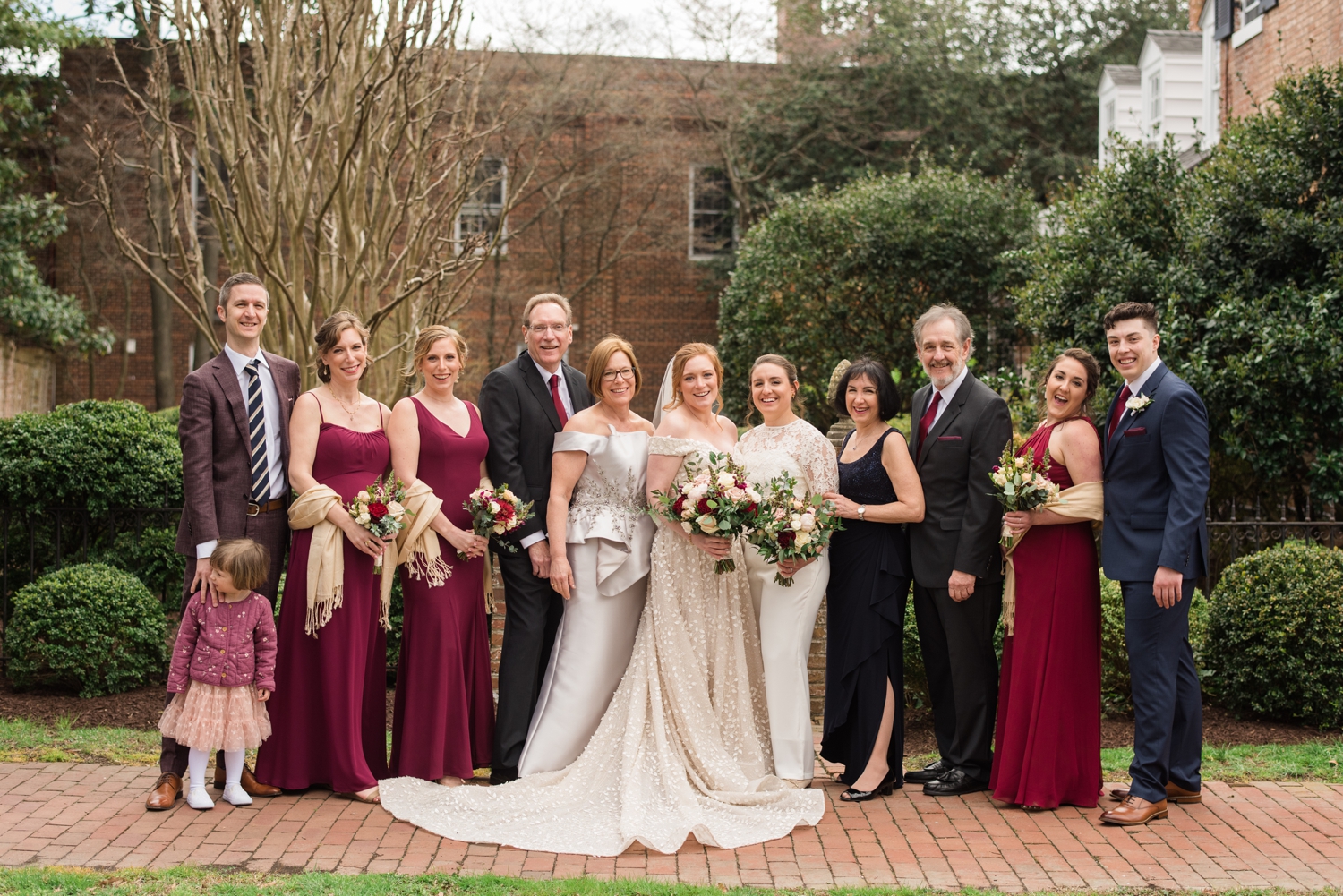 brides pose for family formals