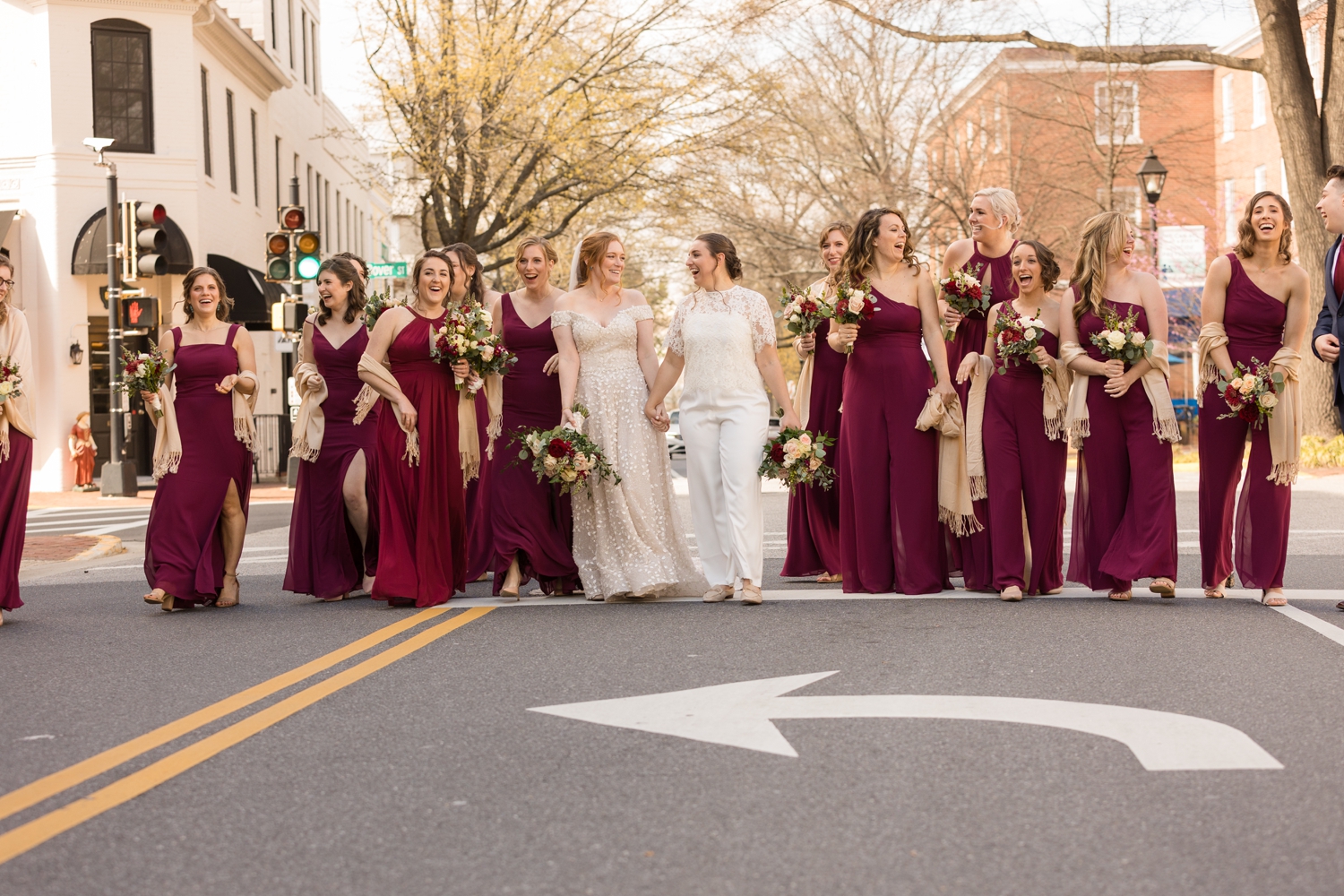 wedding party poses in the street