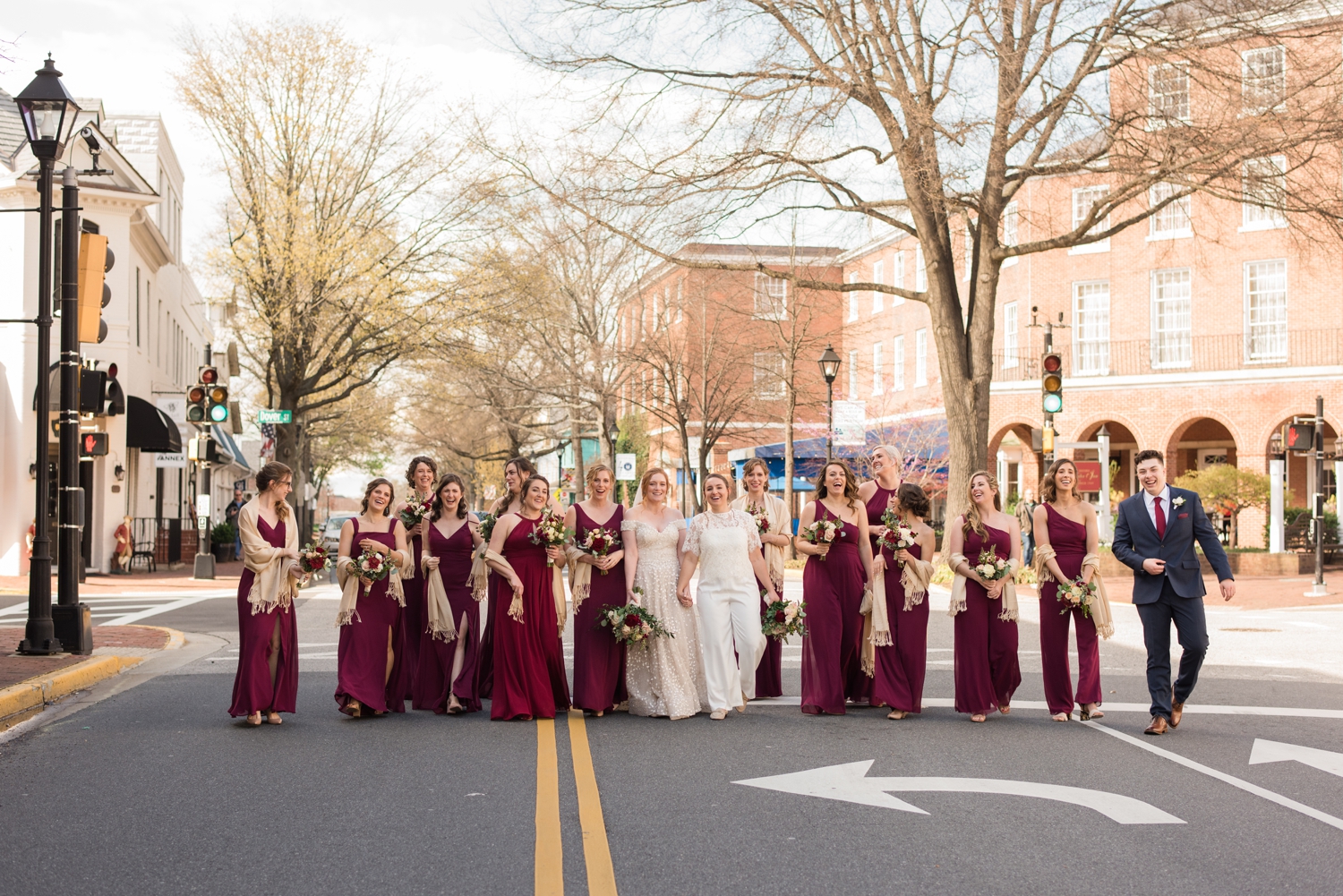 wedding party poses in the street