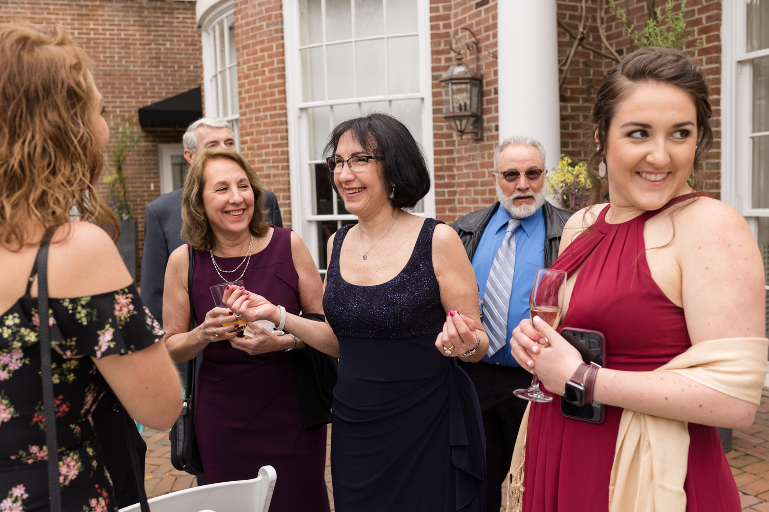 wedding guests enjoy cocktail hour at the Tidewater Inn