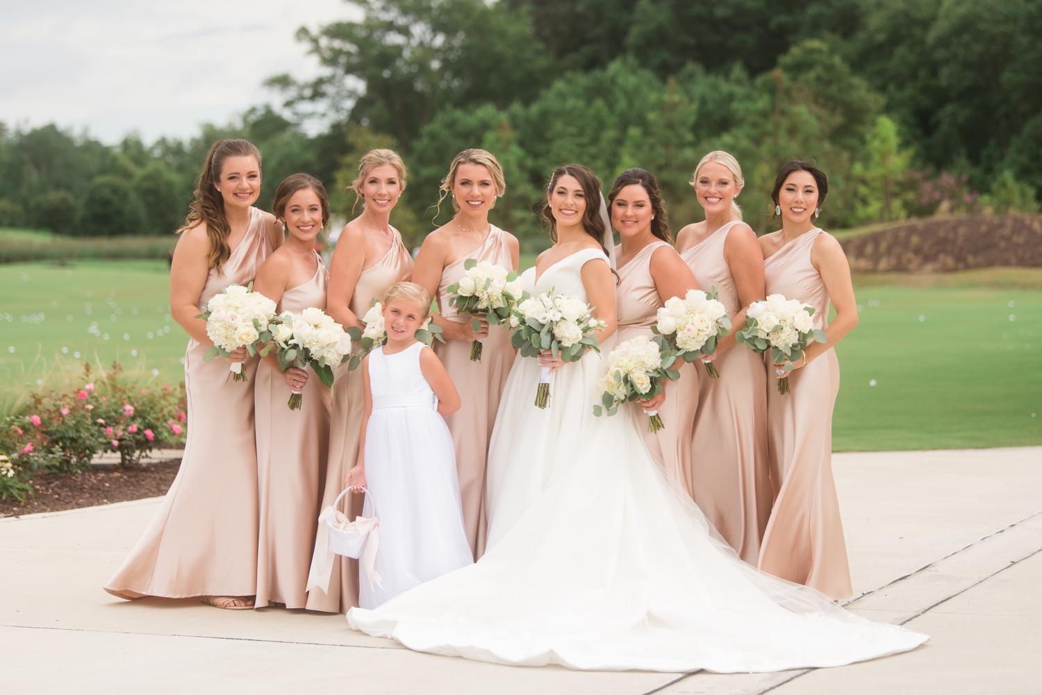 bride poses with bridesmaids