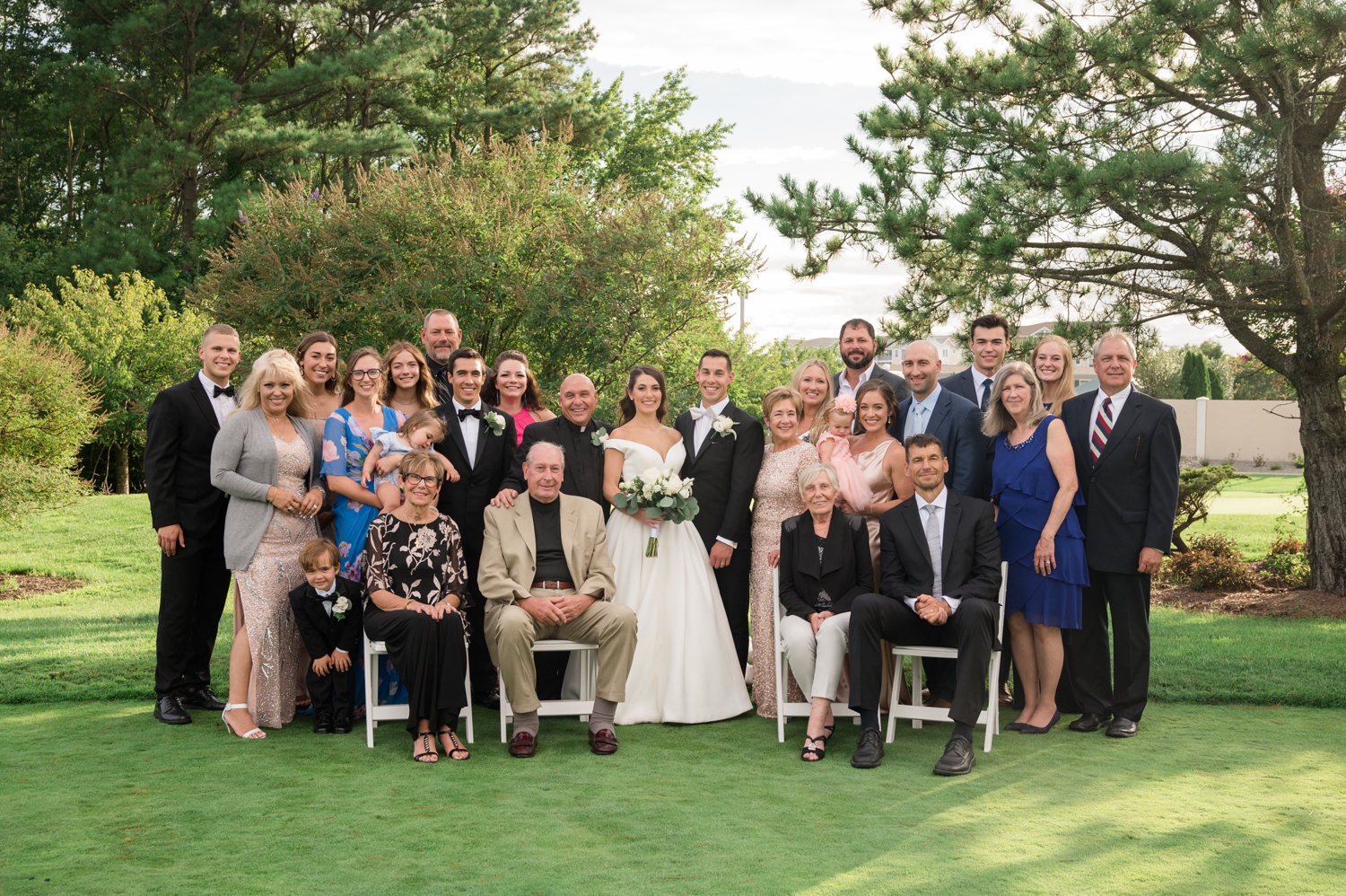 bride and groom with family