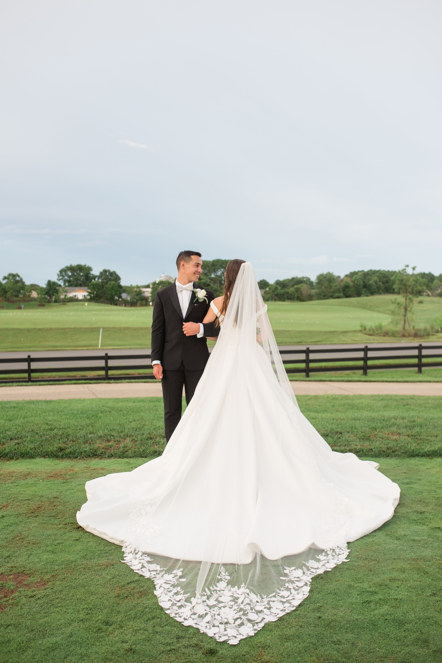 bride and groom showcasing vail