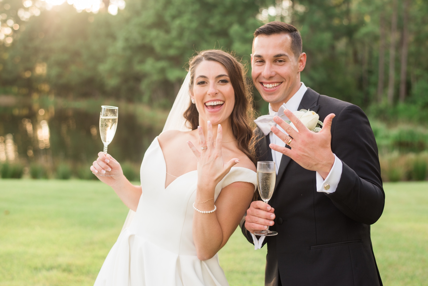 bride and groom showcasing rings