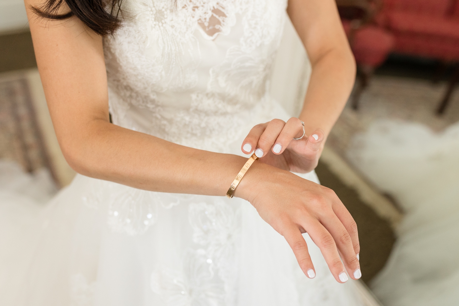 bride puts on wedding jewelry at Hyatt Regency Bethesda