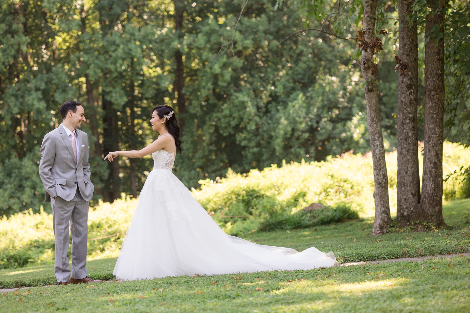 bride and groom share first look on the grounds of Woodend Sanctuary & Mansion 