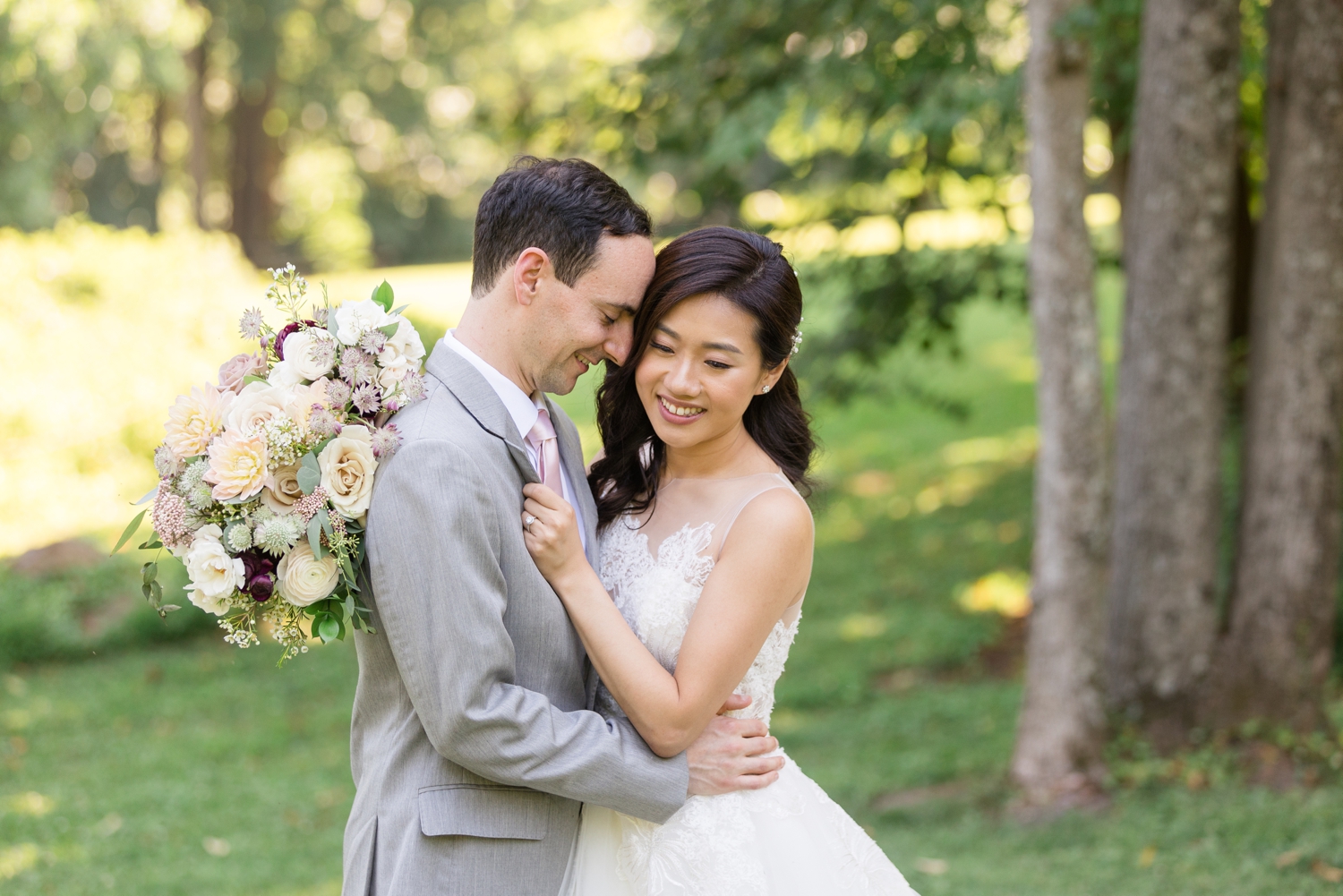 bride and groom pose together on the grounds at Woodend Sanctuary & Mansion 