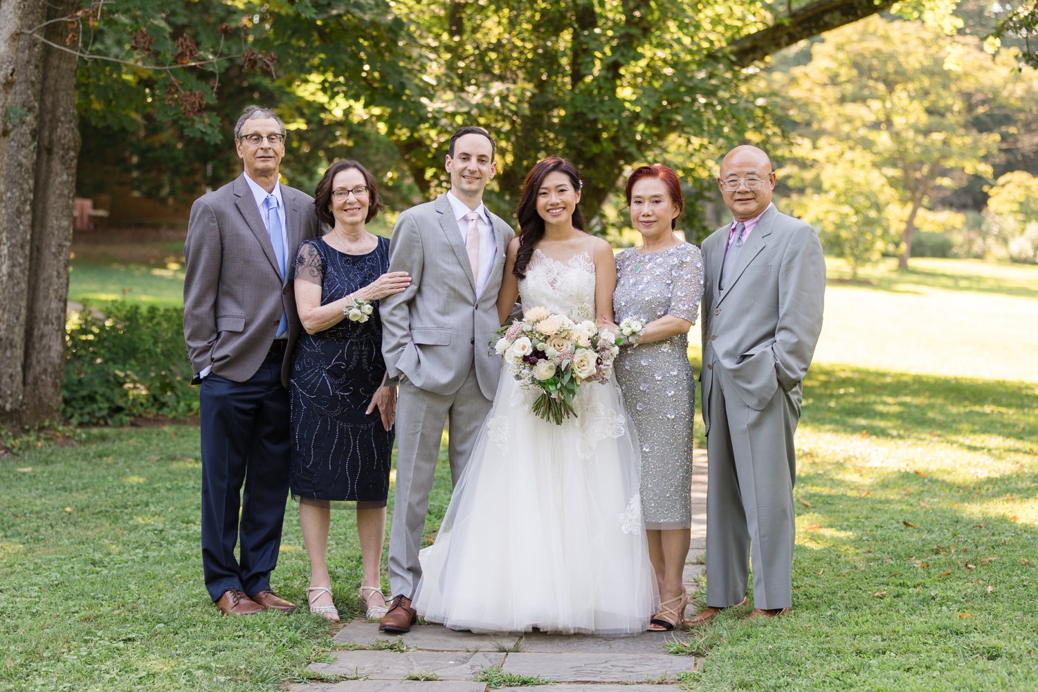 bride and groom pose for family formals at Woodend Sanctuary & Mansion 