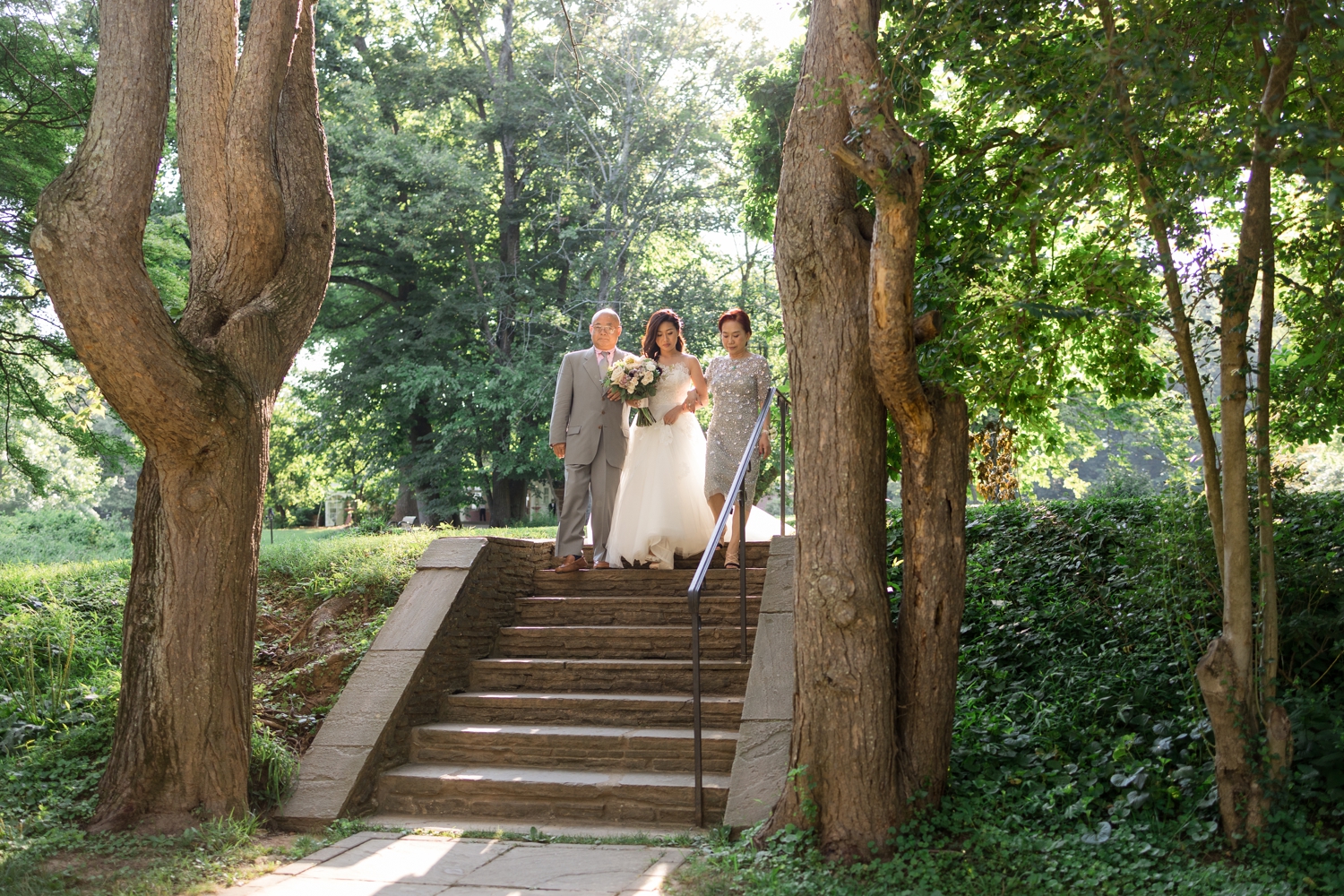 parents escort bride into ceremony on the Woodend Sanctuary & Mansion 