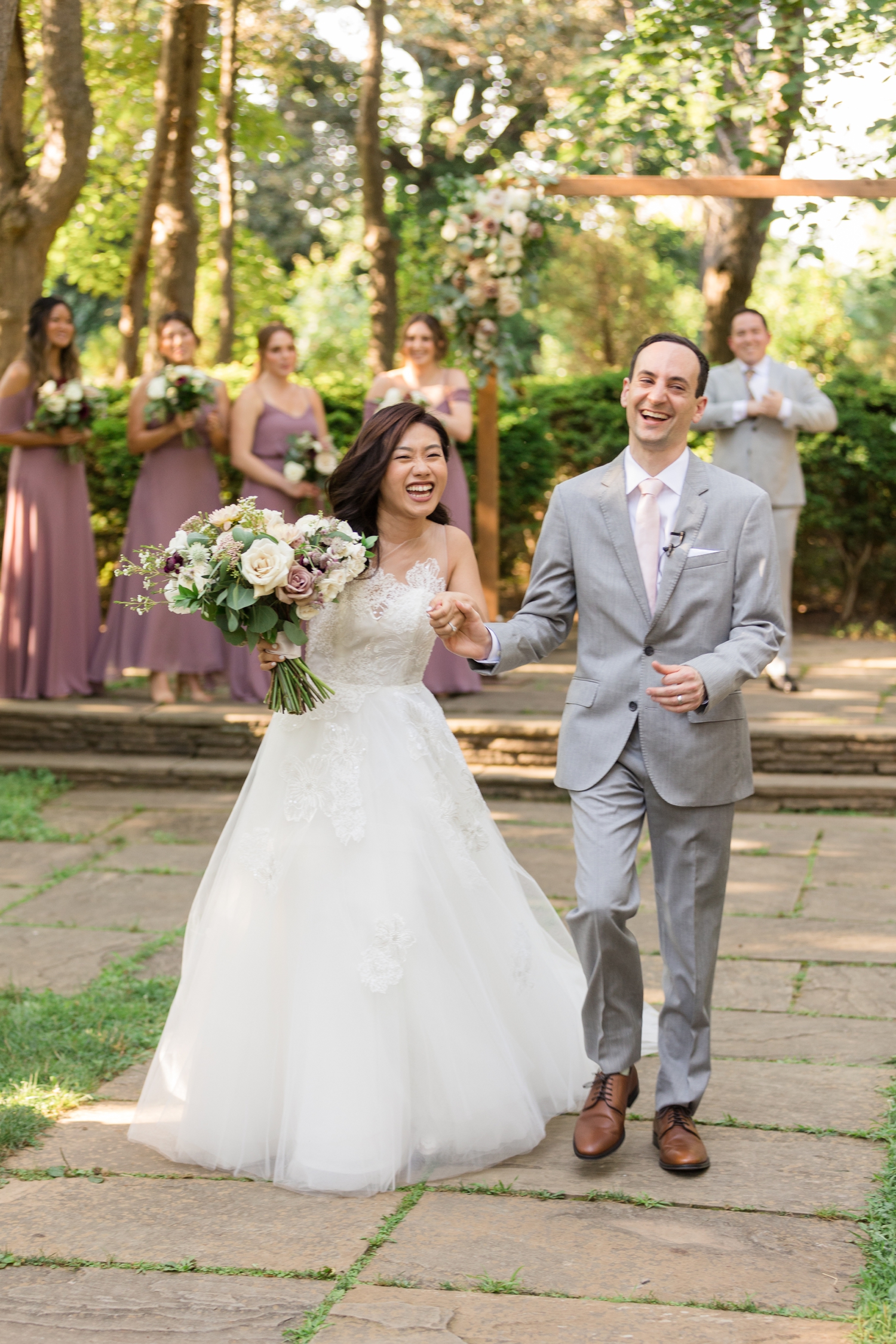 bride and groom share a laugh after their ceremony at Woodend Sanctuary & Mansion 