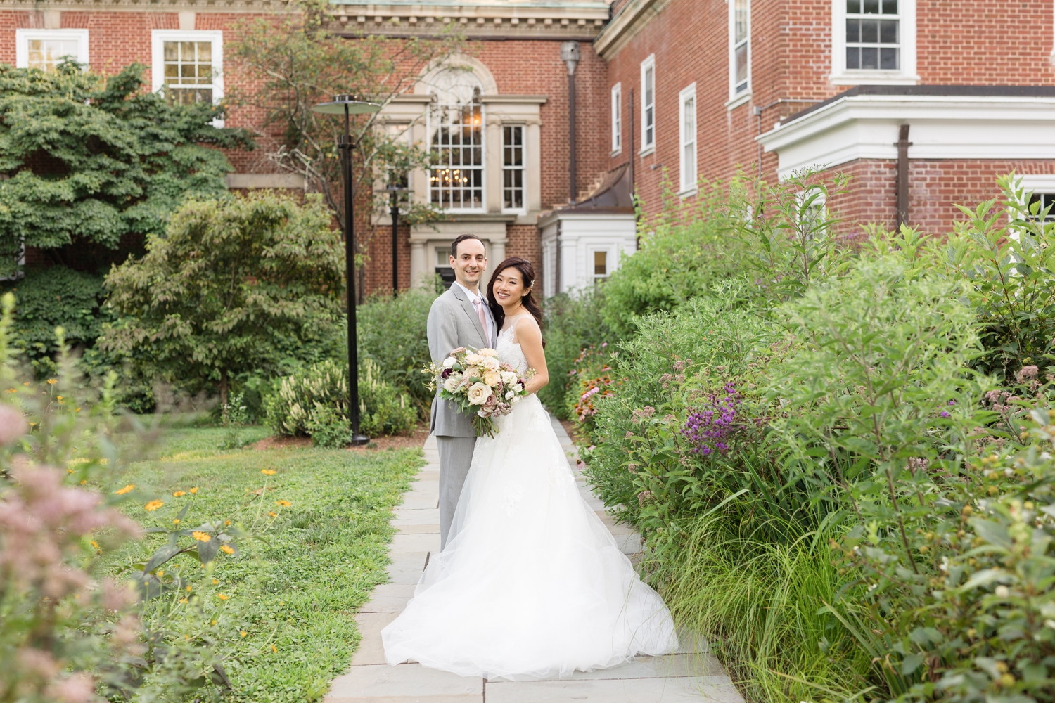 bride and groom pose on the grounds atWoodend Sanctuary & Mansion 