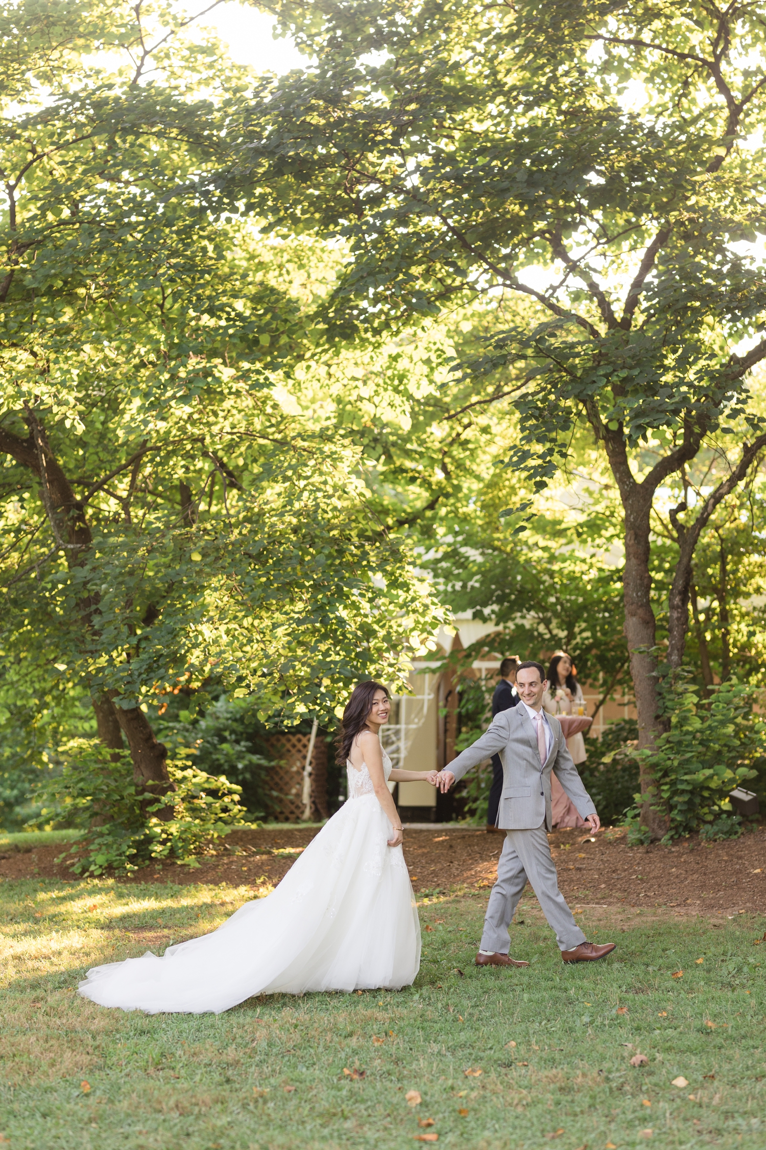 bride and groom head into cocktail hour at Woodend Sanctuary & Mansion 