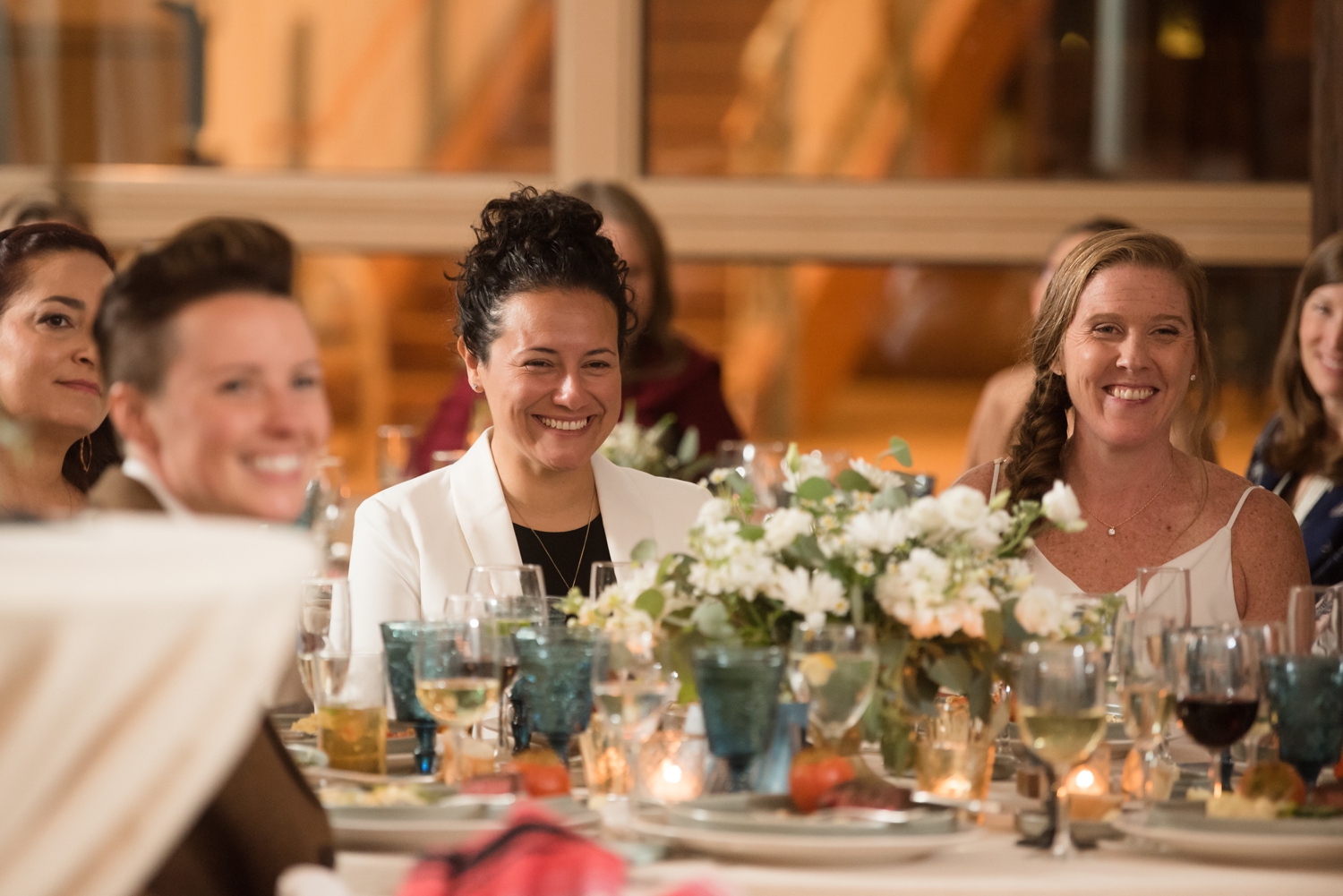 Chesapeake Bay Foundation tented reception wedding toasts two brides