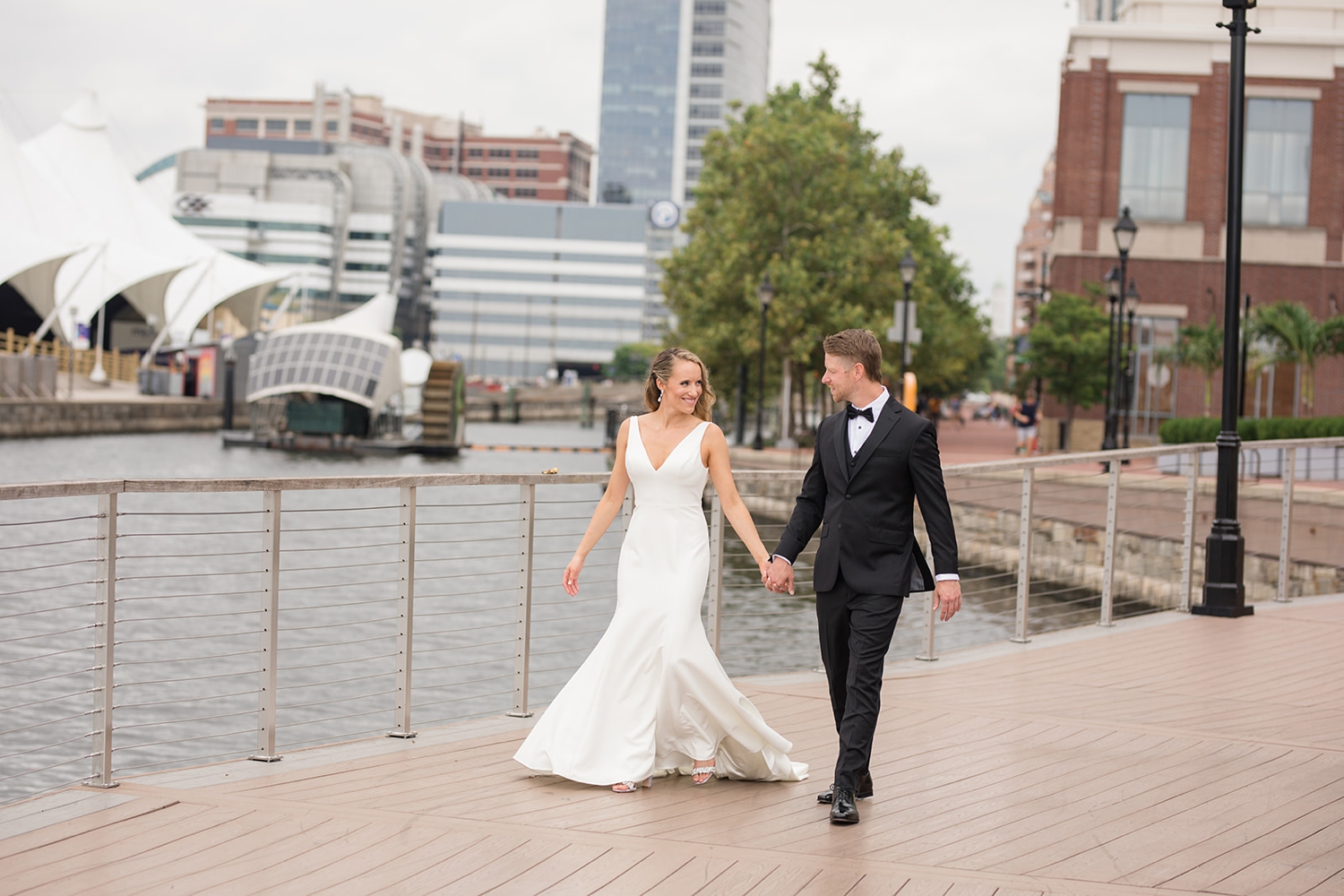 Baltimore harbor first look with bride and groom in black tux