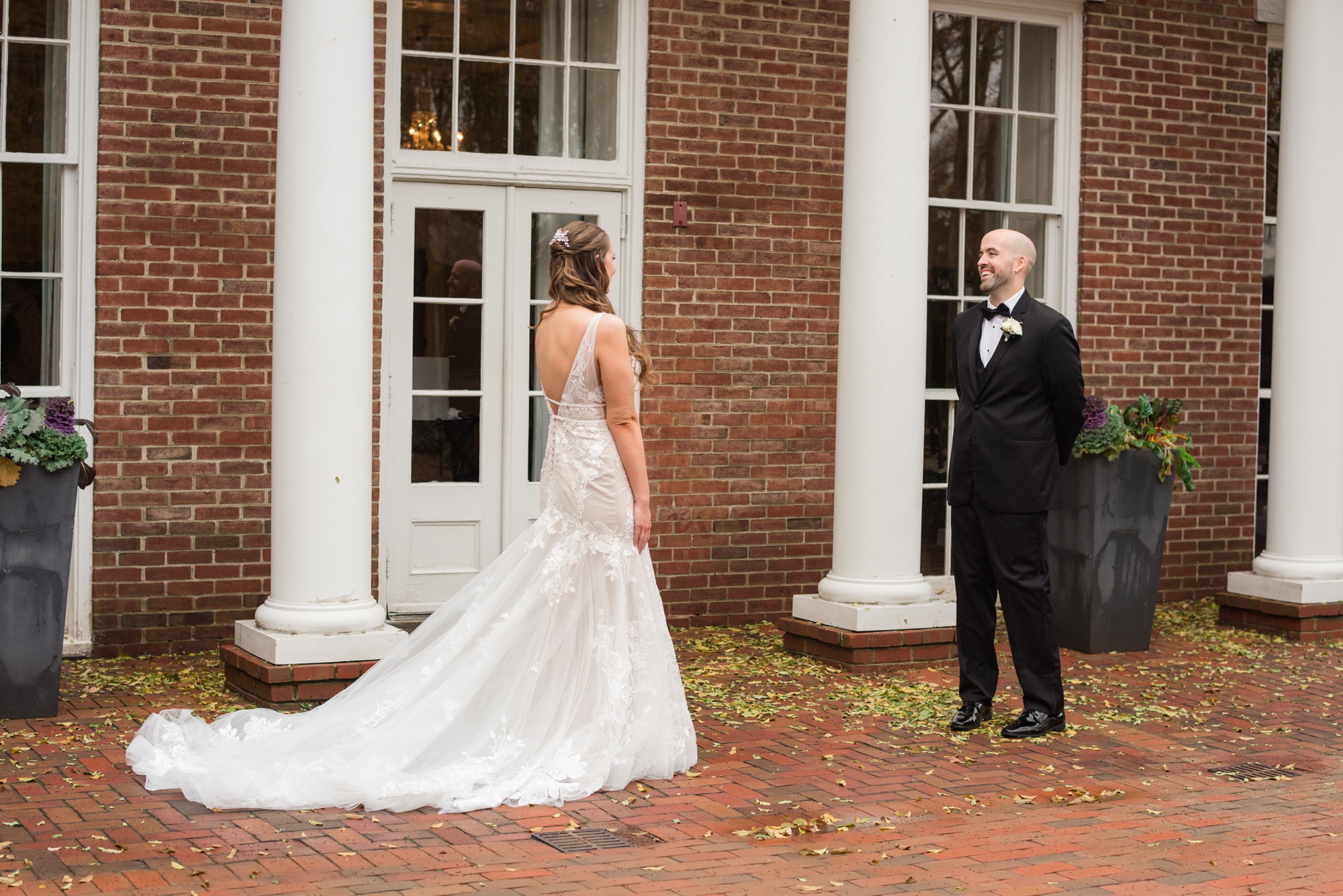 Winter Tidewater inn wedding first look with bride and groom in the courtyard