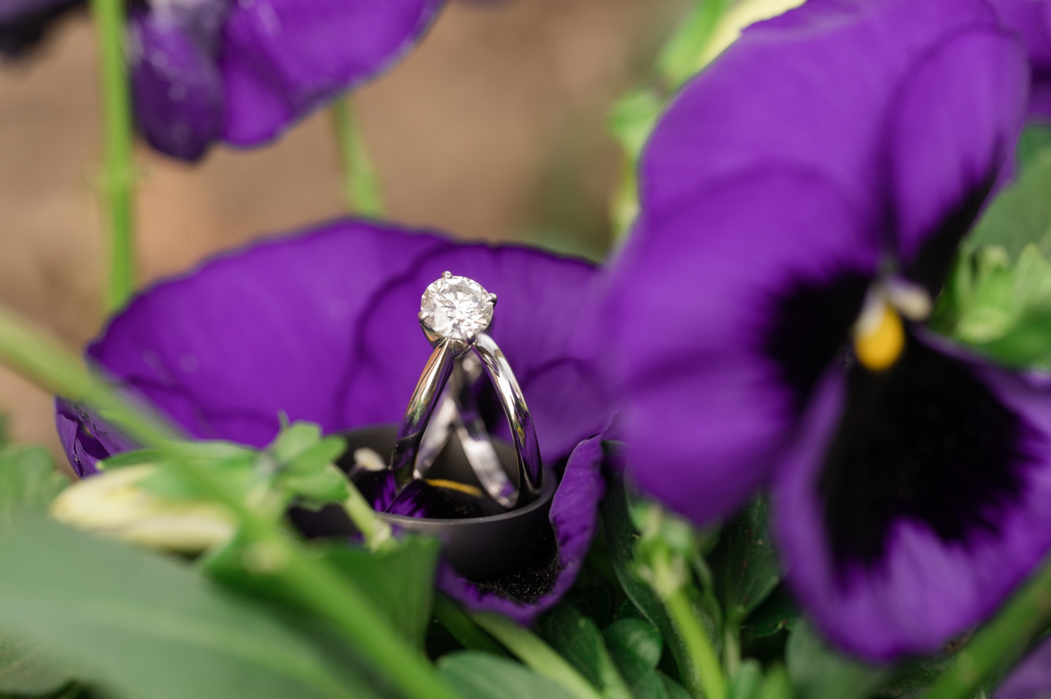 purple flower wedding band and engagement ring detail