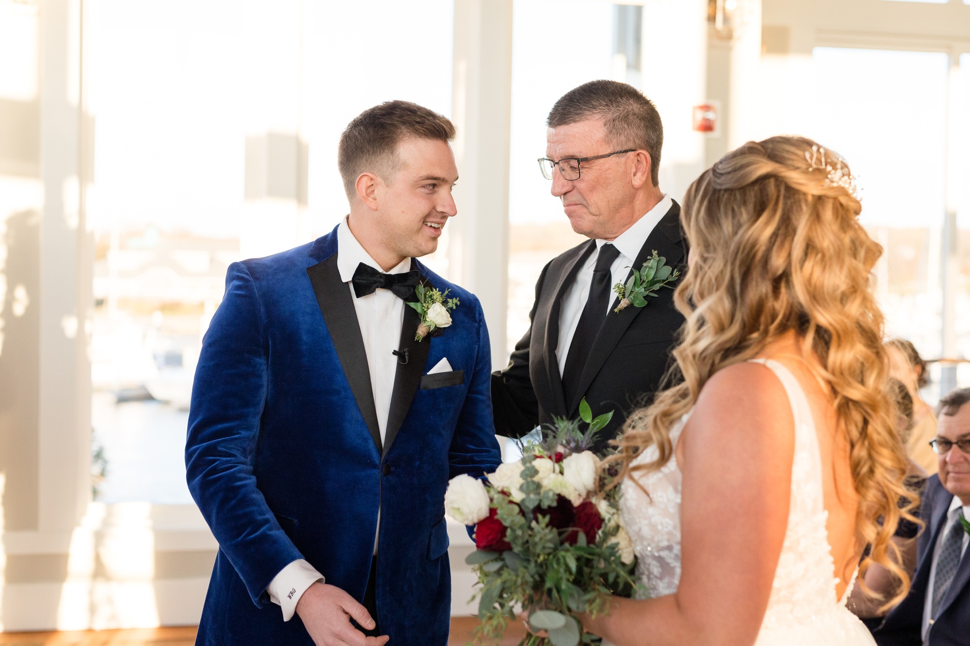 Chesapeake Bay Beach Club wedding ceremony in sunset ballroom