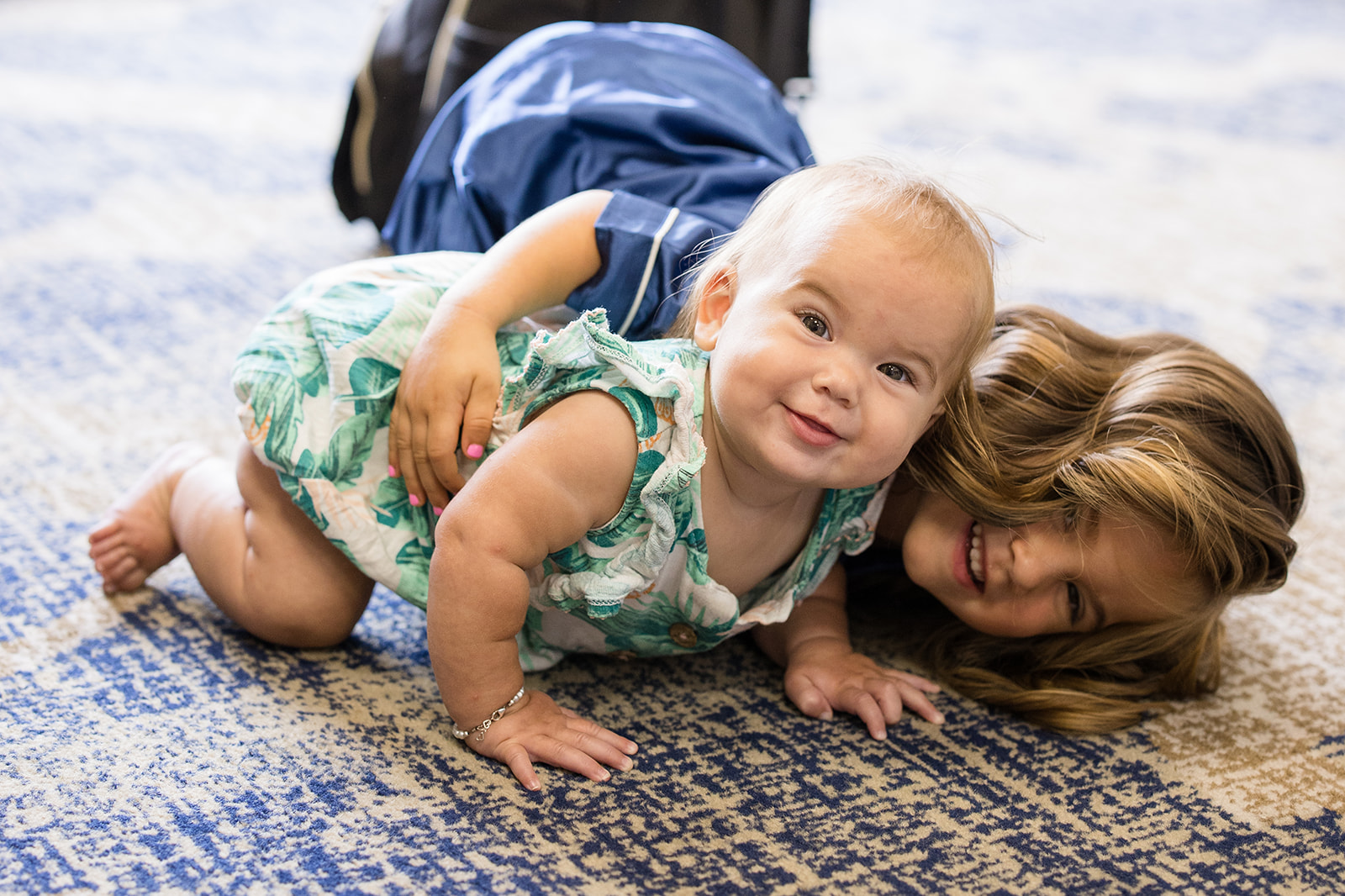 Children play together on the carpet