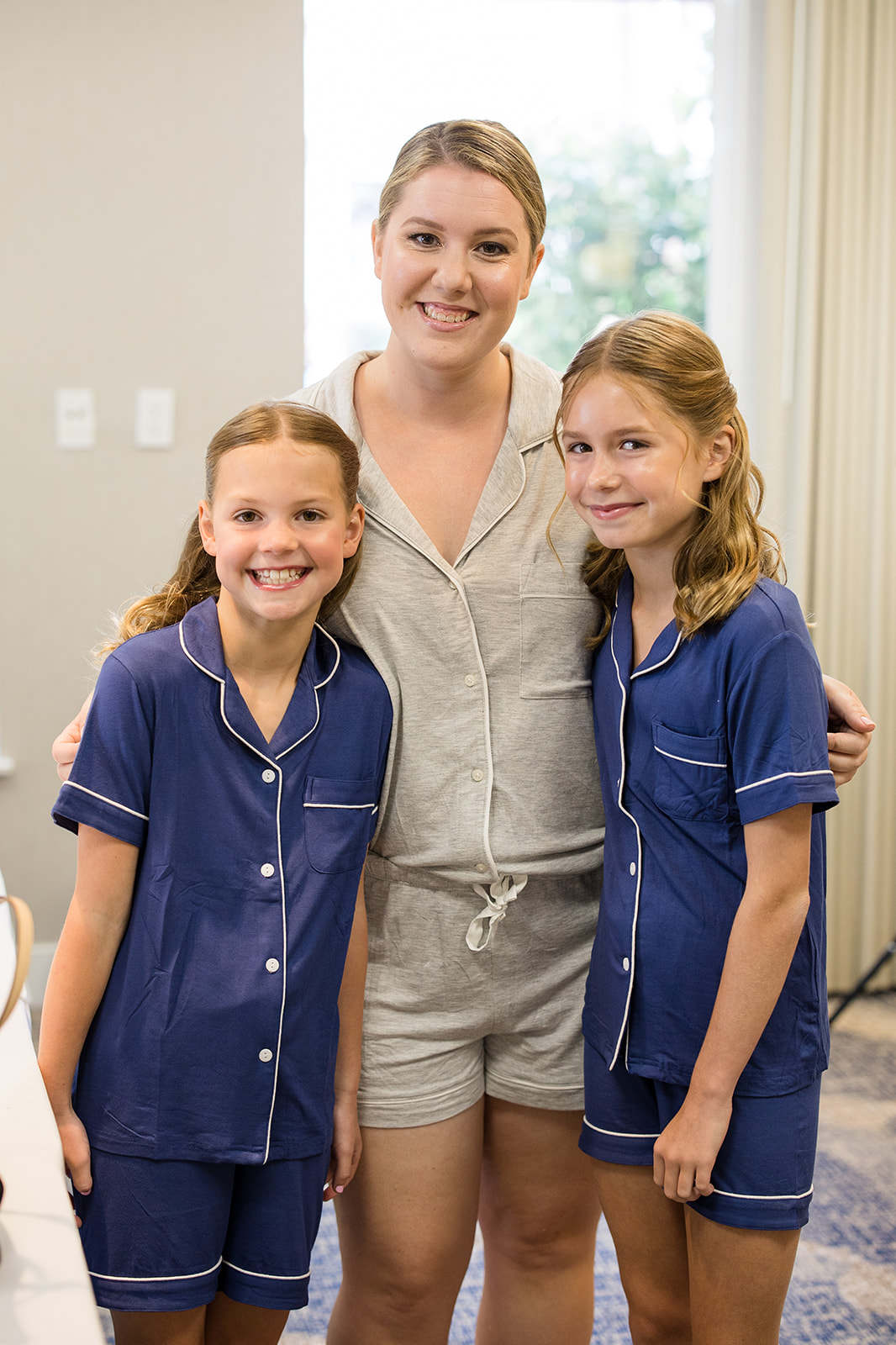 Bride in pajamas with her flower girls