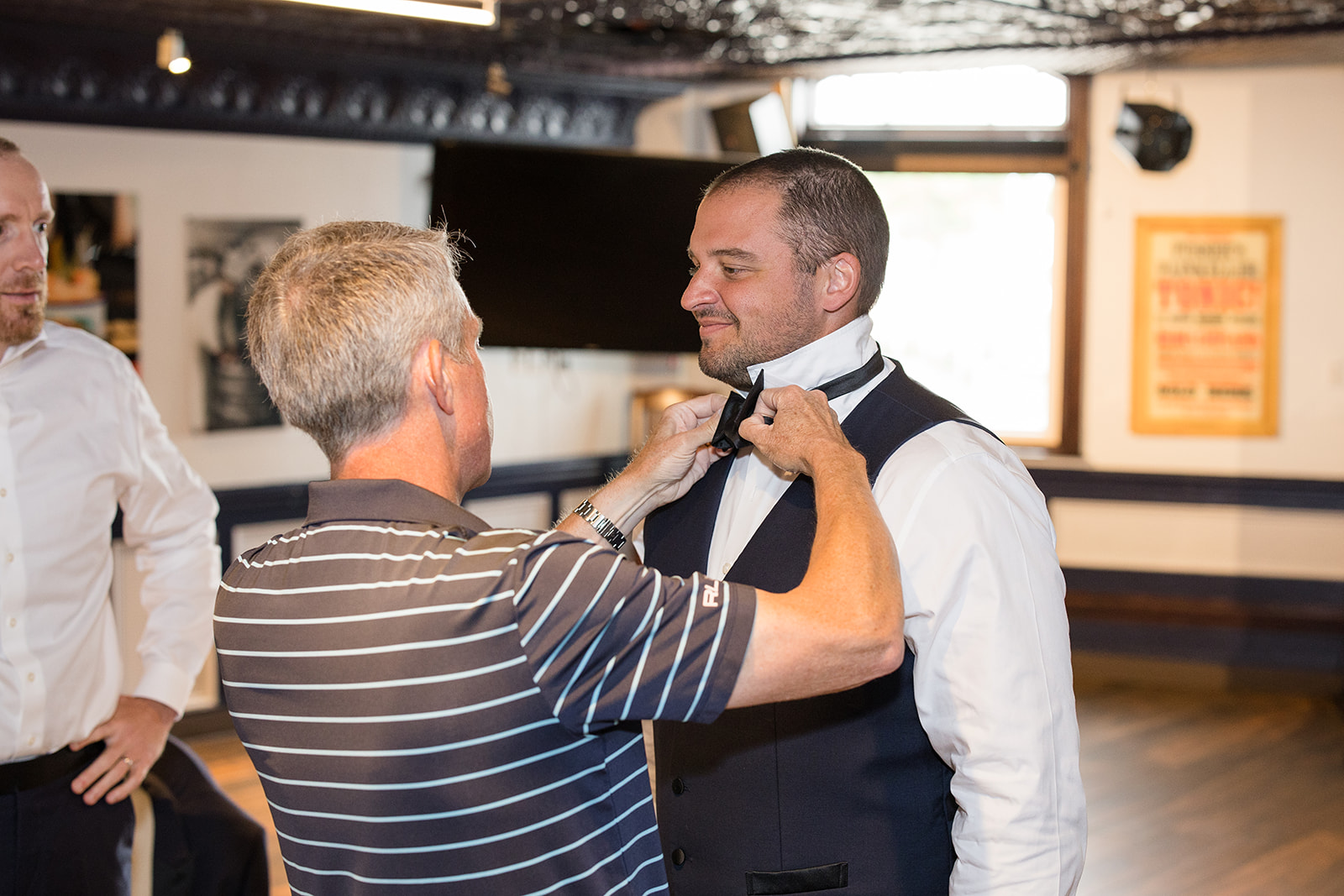 Groom gets help with his tie