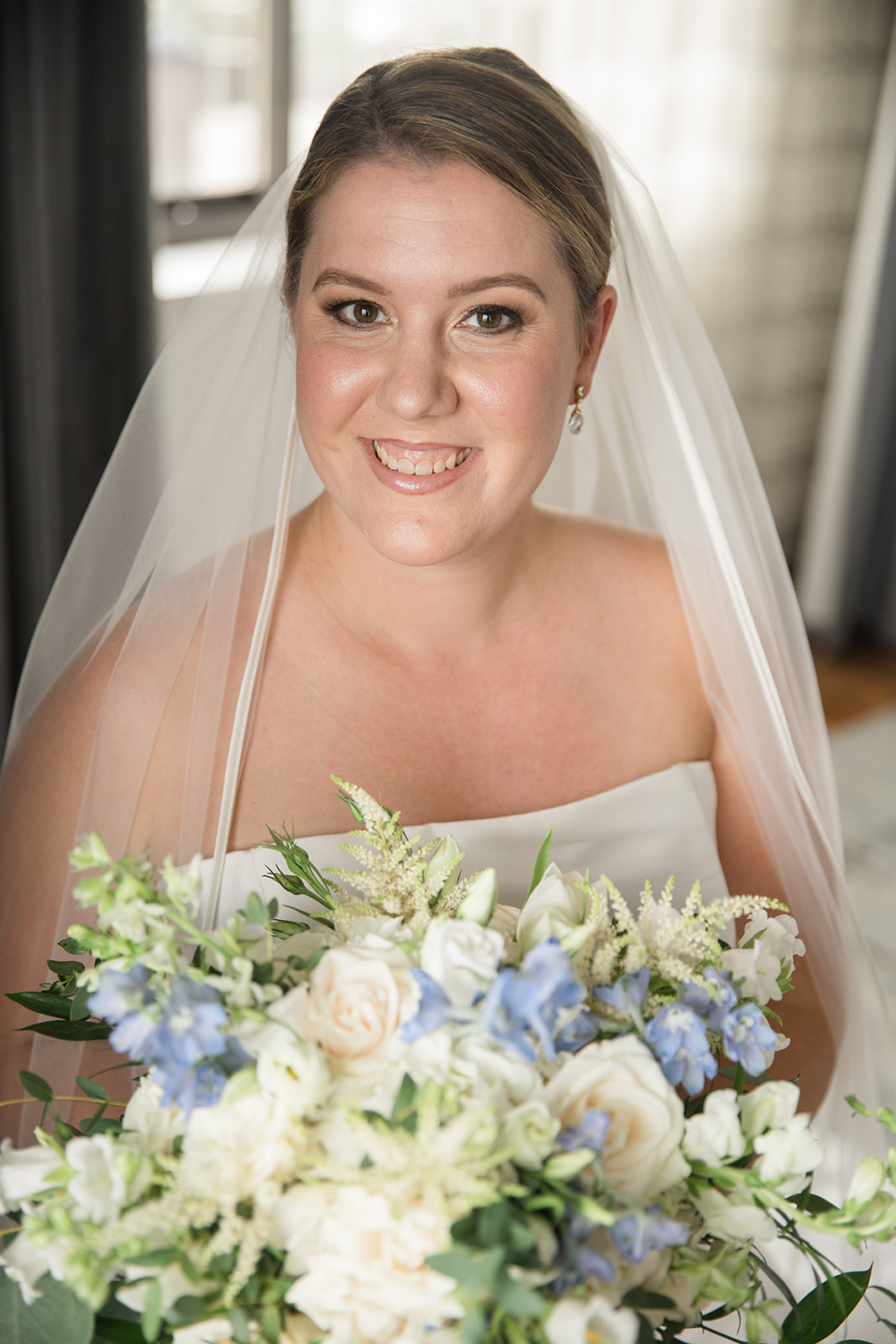 Bridal portrait with bouquet and veil