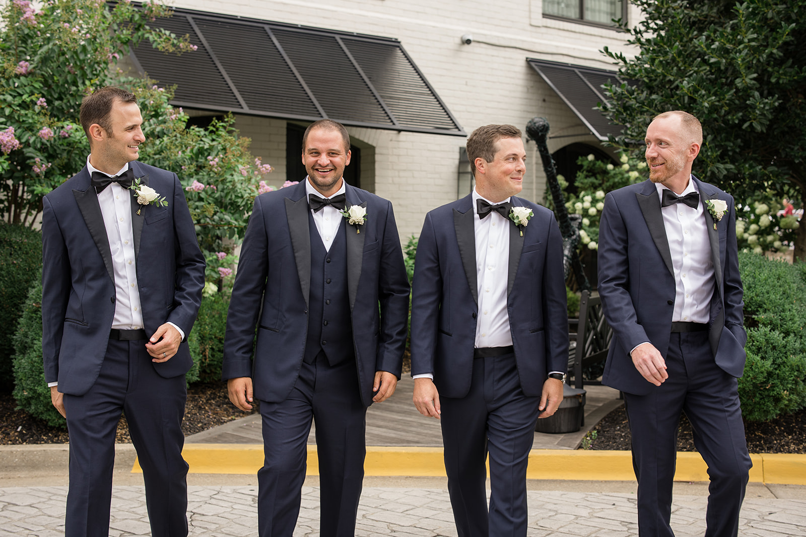 Groom and groomsmen portrait while walking